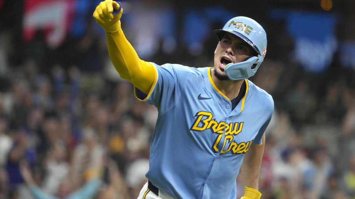 Milwaukee Brewers' Willy Adames (27) reacts to hitting a three-run home run during the first inning of a baseball game against the Cleveland Guardians, Friday, Aug. 16, 2024, in Milwaukee.