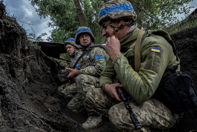 Ukrainian servicemen hide from shelling, amid Russia's attack on Ukraine, near the Russian border in Sumy region, Ukraine, Aug. 13.