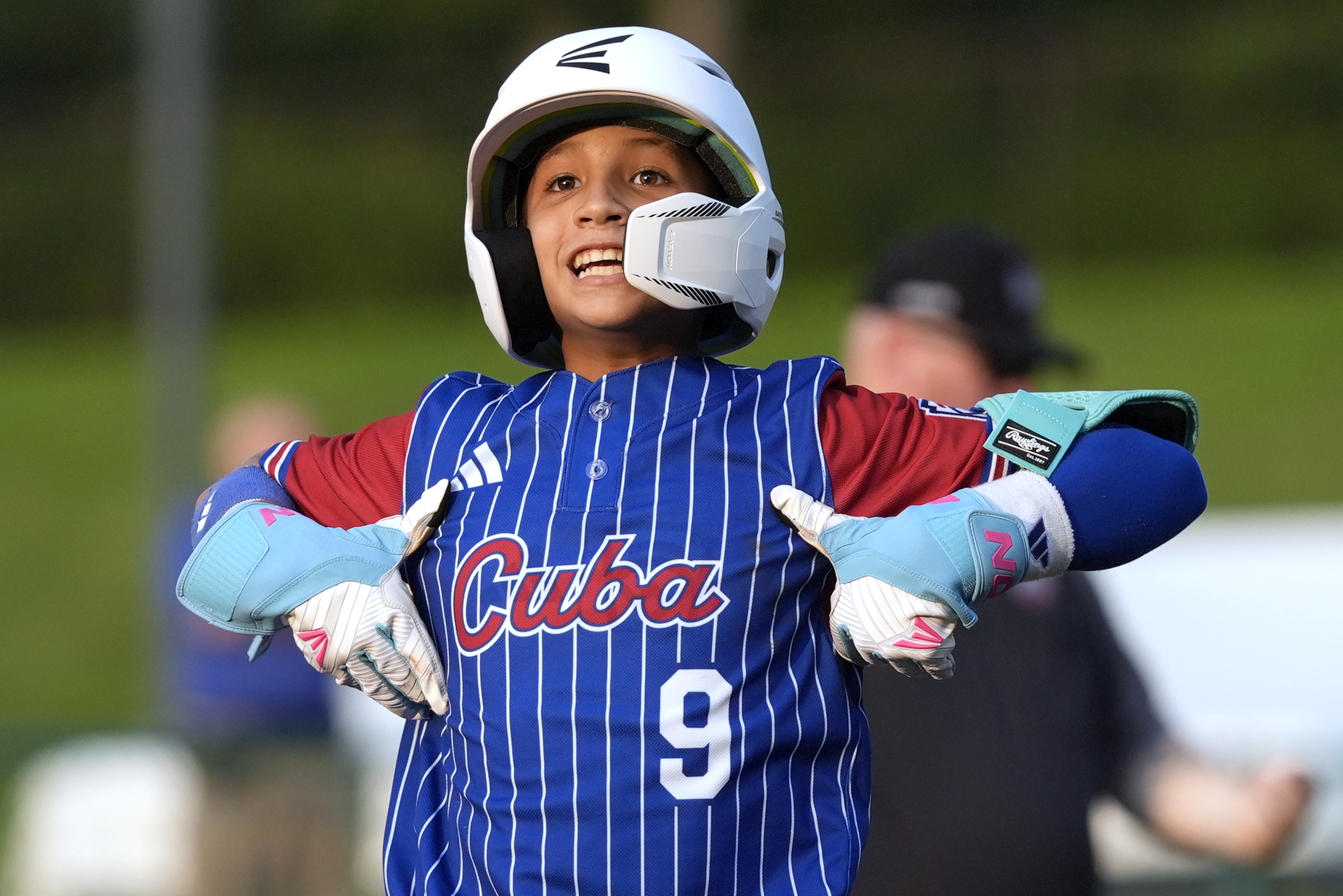 Cuba's Adrian Fuentes (9) celebrates on second base after driving in a run against Czech Republic during the sixth inning of a baseball game at the Little League World Series tournament in South Williamsport, Pa., Thursday, Aug. 15, 2024. 