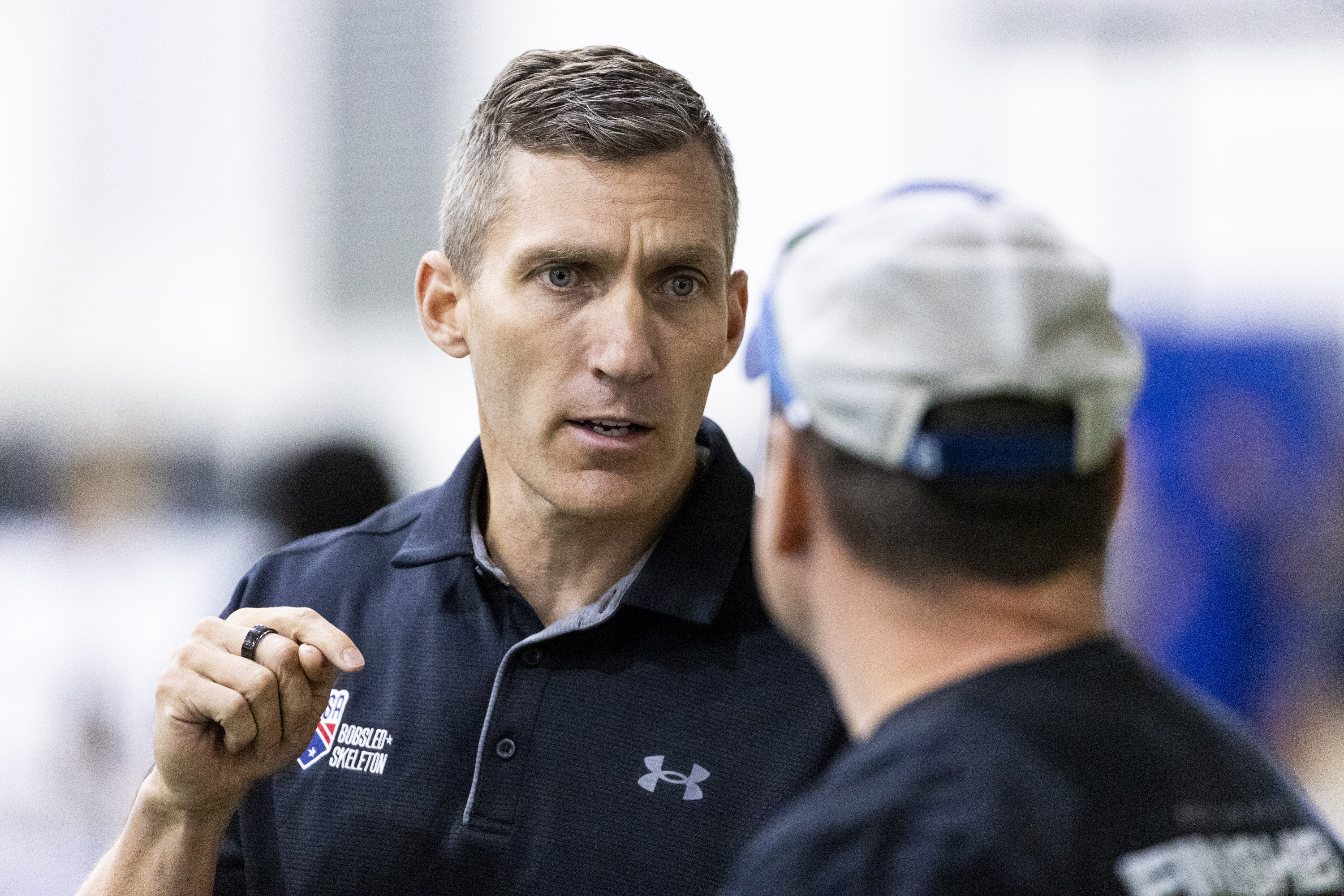 Chris Fogt, head coach of the USA Bobsled Team, talks with an athlete during a recruiting combine for the USA Bobsled and Skeleton Teams held at the Utah Olympic Oval in Kearns on Saturday.