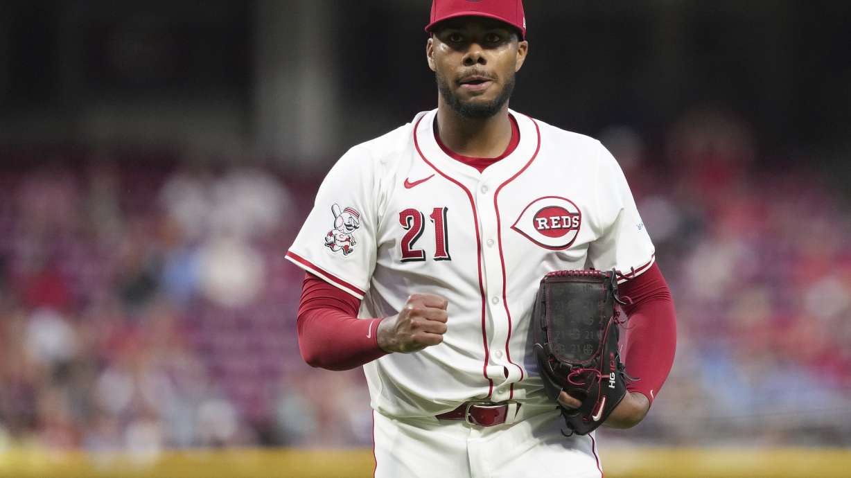 Cincinnati Reds' Hunter Greene pumps his fist after walking off the mound during the seventh inning of a baseball game against the St. Louis Cardinals, Tuesday, Aug. 13, 2024, in Cincinnati.