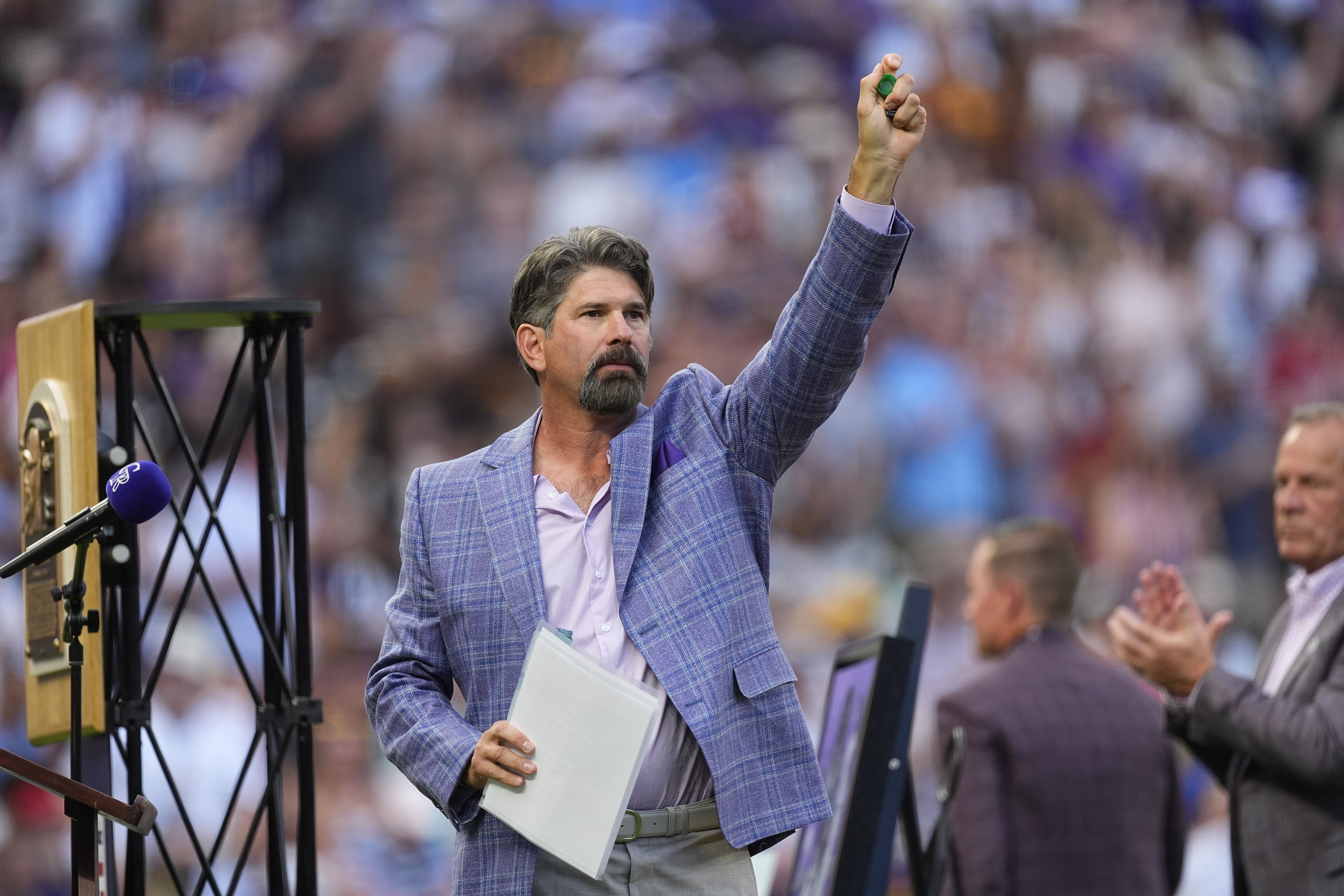 Retired Colorado Rockies first baseman and Major League Baseball Hall of Famer Todd Helton waves to the crowd during a ceremony to mark his induction into the Hall last month before a baseball game, Saturday, Aug. 17, 2024, in Denver. 