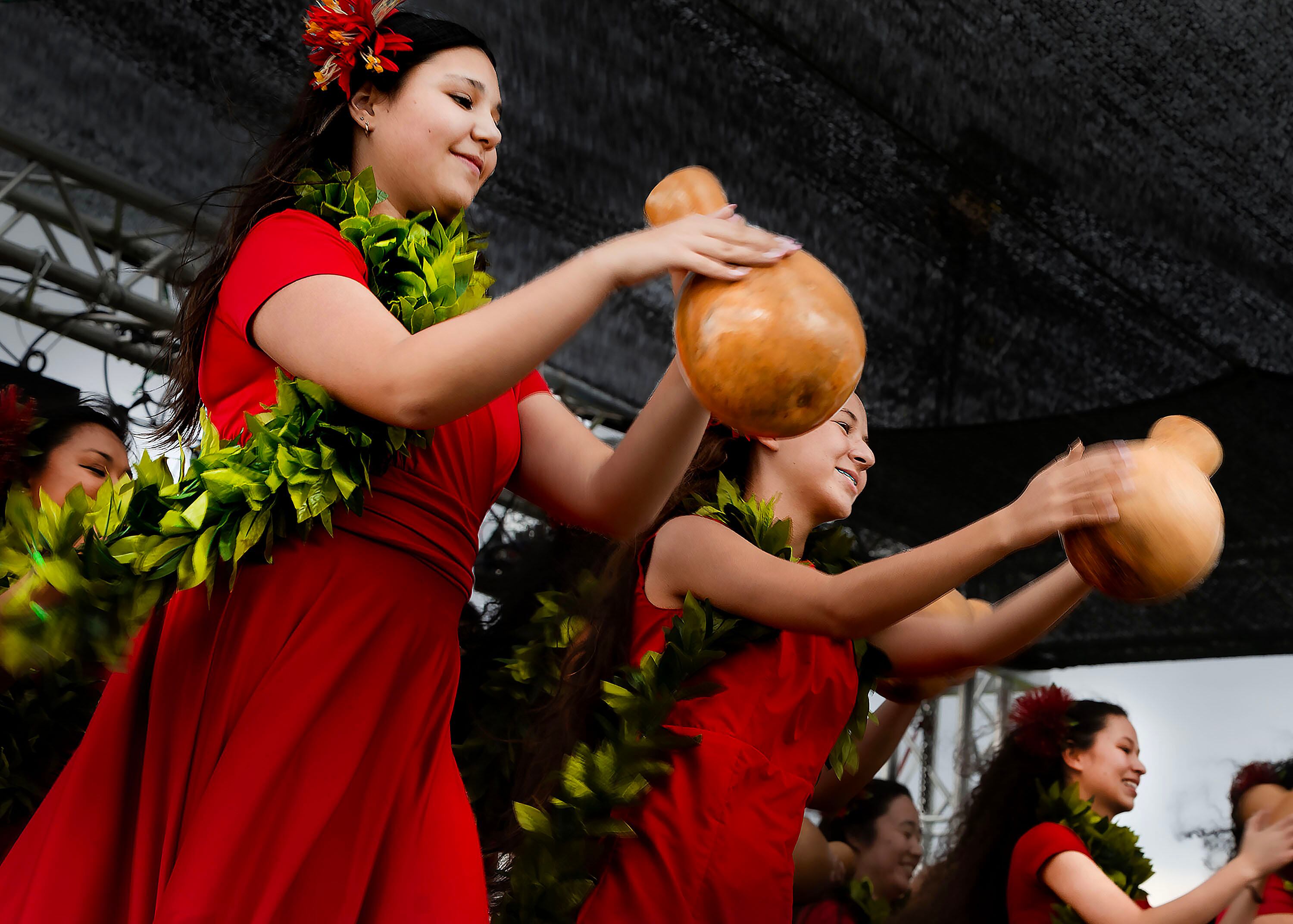 Dancers with Halau Ku Pono I Kamalani perform while holding ipus at the 12th Annual Utah Pacific Island Heritage Month Kick Off Festival in Kearns on Aug. 3. The song the women were dancing to is about the worth of something that's pretty on the outside, but hollow inside.