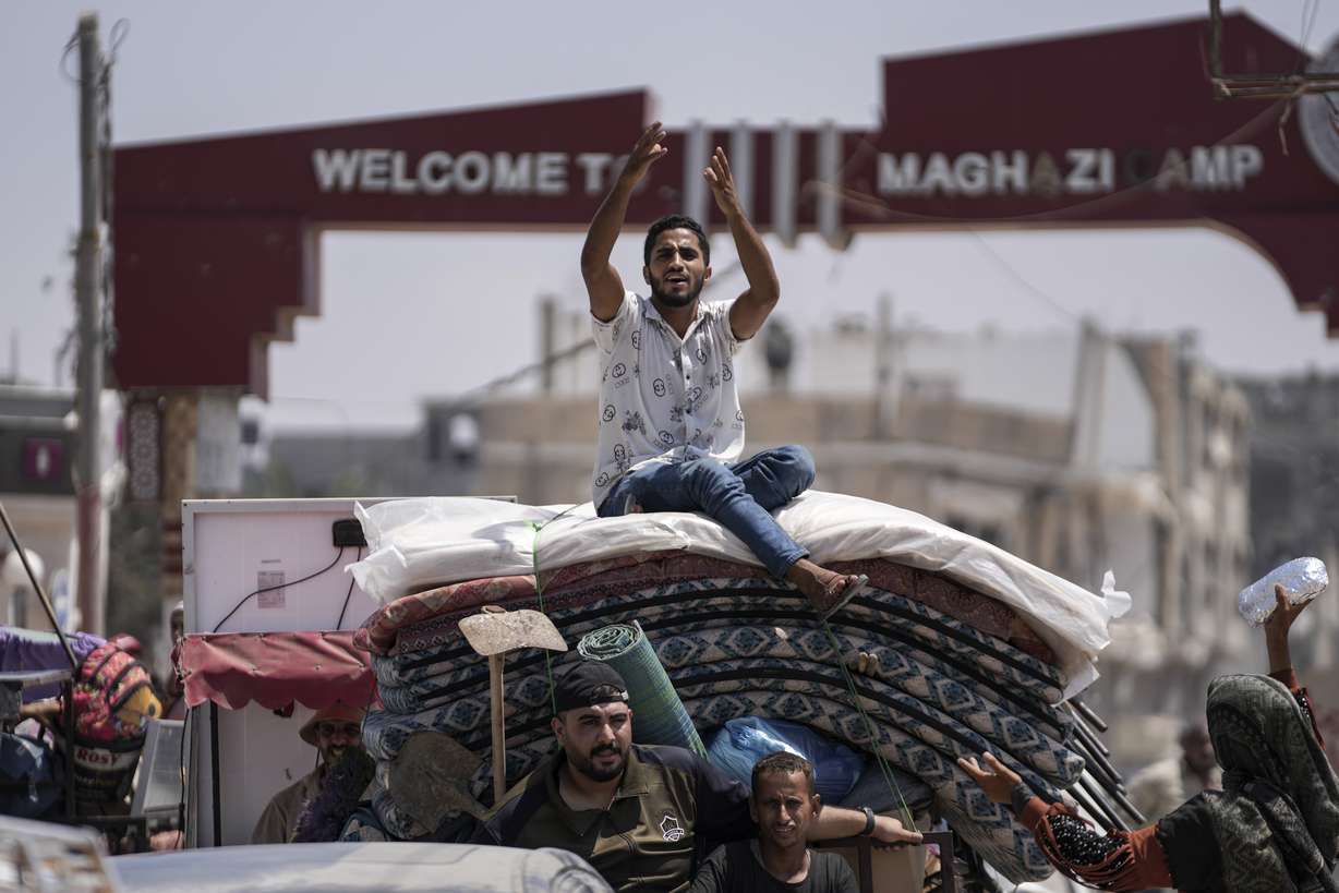 Palestinians evacuate Maghazi refugee camp in the central Gaza Strip, as part of a mass evacuation ordered by the Israeli military ahead of an operation, Saturday.