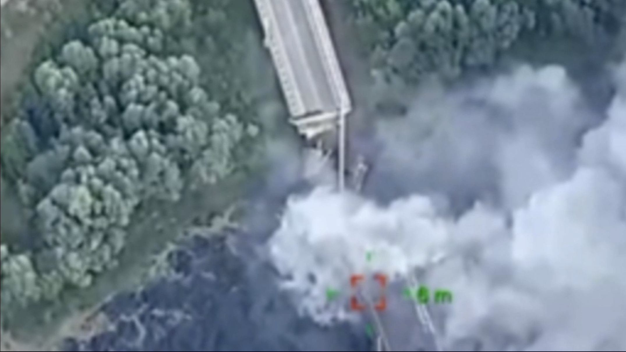 In this photo provided by the Ukrainian Defence Ministry Press Office, a strategically important bridge over the river Seym is destroyed by Ukrainian troops as they continue their incursion into the Kursk region, Russia, Friday. The bridge was used by the Kremlin to supply its troops and its destruction could hamper their efforts.