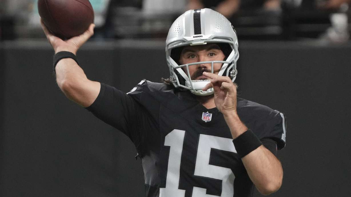 Las Vegas Raiders quarterback Gardner Minshew (15) warms up before an NFL preseason football game against the Dallas Cowboys, Saturday, Aug. 17, 2024, in Las Vegas.