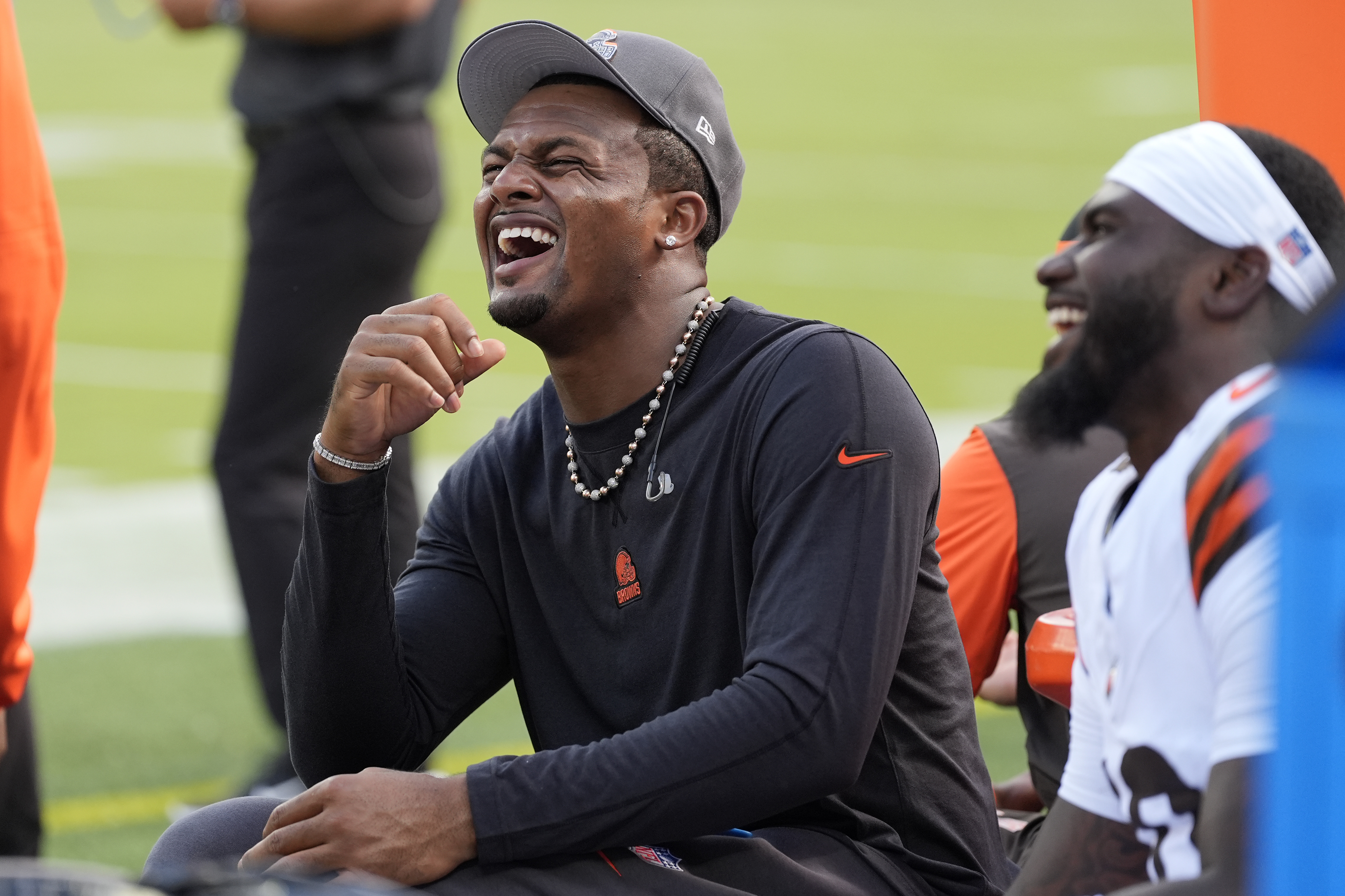 Cleveland Browns quarterback Deshaun Watson talks with teammates on the sidelines during the first half of an NFL preseason football game against the Minnesota Vikings, Saturday, Aug. 17, 2024, in Cleveland. 
