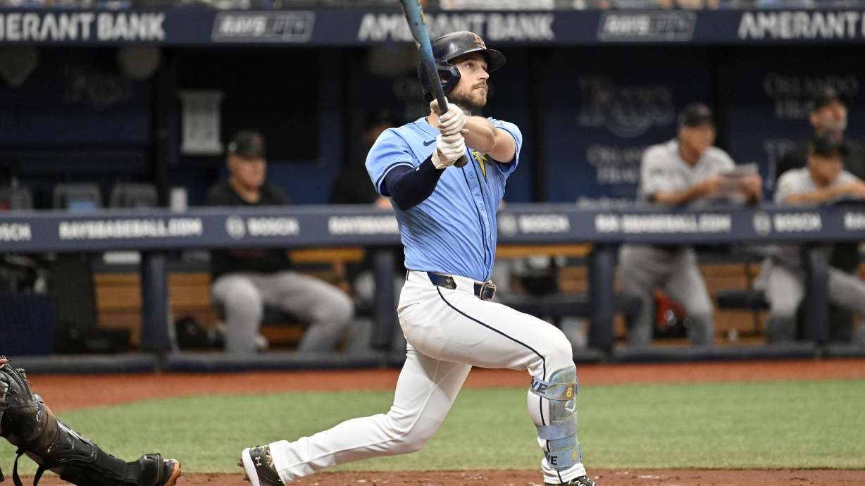 Tampa Bay Rays second base Brandon Lowe hits a two-run home run against the Arizona Diamondbacks during the third inning of a baseball game Sunday, Aug. 18, 2024, in St. Petersburg, Fla.