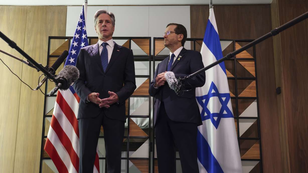 Secretary of State Antony Blinken, left, meets with Israel's President Isaac Herzog, in Tel Aviv, Israel, Monday. Blinken says Israel has accepted a proposal to bridge differences holding up a cease-fire and hostage release in Gaza.
