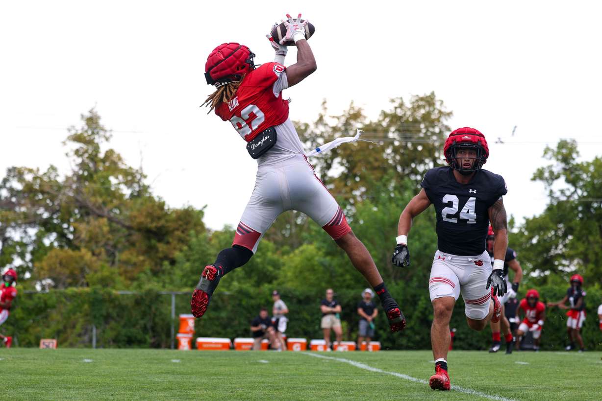 Utah tight end Landen King jumps up for a pass during practice on Aug. 5, 2024.