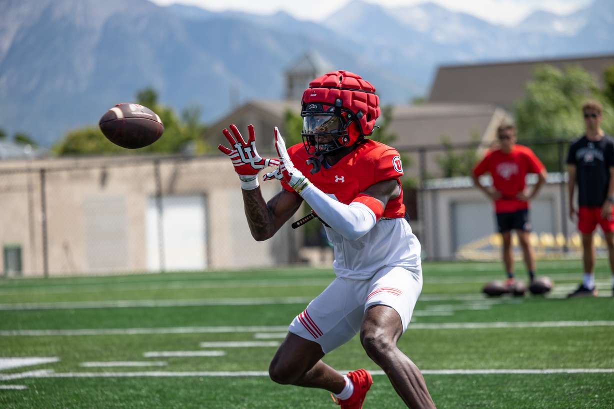 Utah receiver Damien Alford prepares to catch a pass during practice on Aug. 5, 2024.