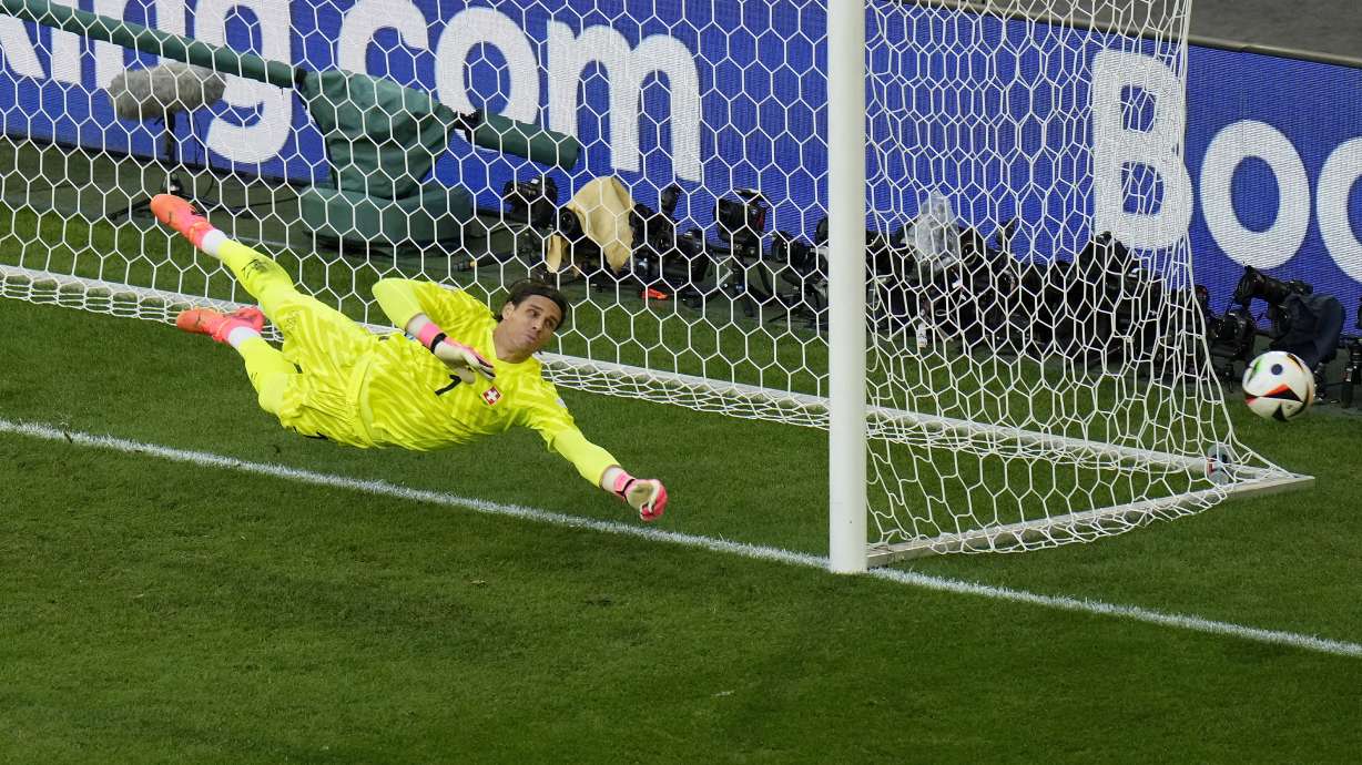 FILE -Switzerland's goalkeeper Yann Sommer dives to attempt a save during a quarterfinal match between England and Switzerland at the Euro 2024 soccer tournament in Duesseldorf, Germany, July 6, 2024.