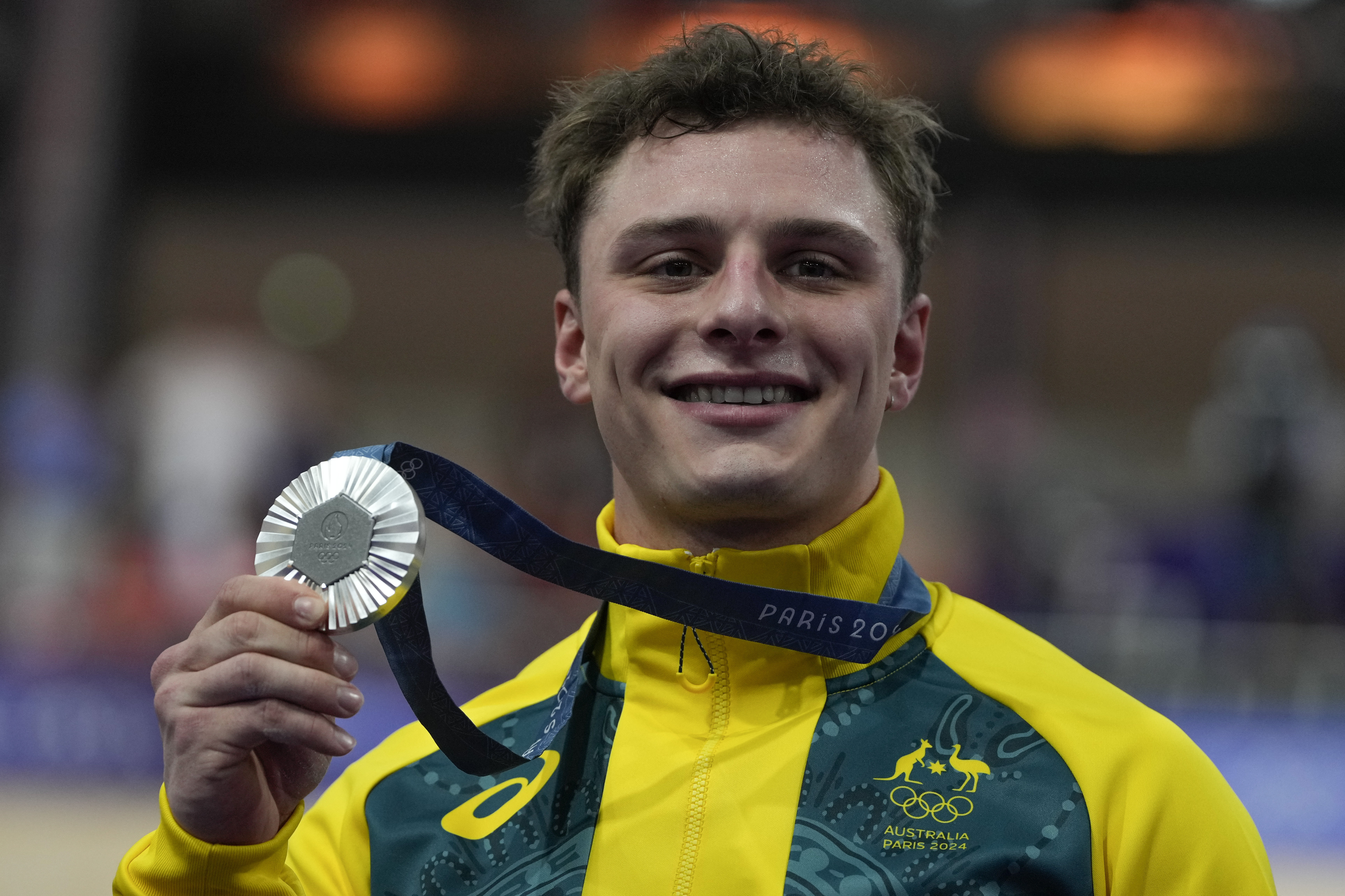 Matthew Richardson of Australia shows the silver medal of the men's sprint event, at the Summer Olympics, Friday, Aug. 9, 2024, in Paris, France. 