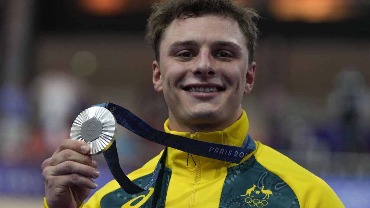 Matthew Richardson of Australia shows the silver medal of the men's sprint event, at the Summer Olympics, Friday, Aug. 9, 2024, in Paris, France.