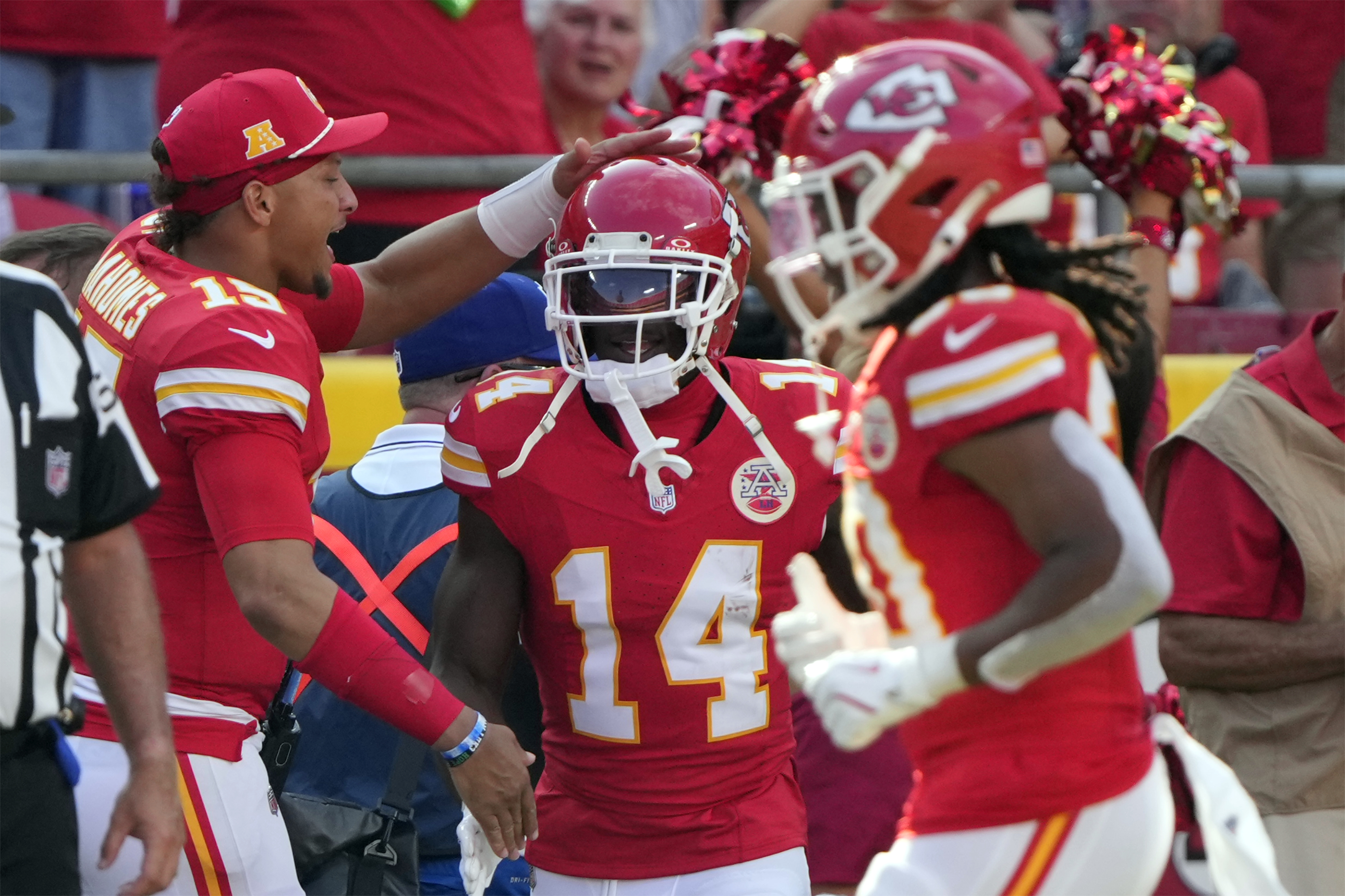 Kansas City Chiefs wide receiver Cornell Powell (14) is congratulated by Patrick Mahomes (15) after his touchdown catch and run against the Detroit Lions during the second half of an NFL preseason football game Saturday, Aug. 17, 2024, in Kansas City, Mo. 