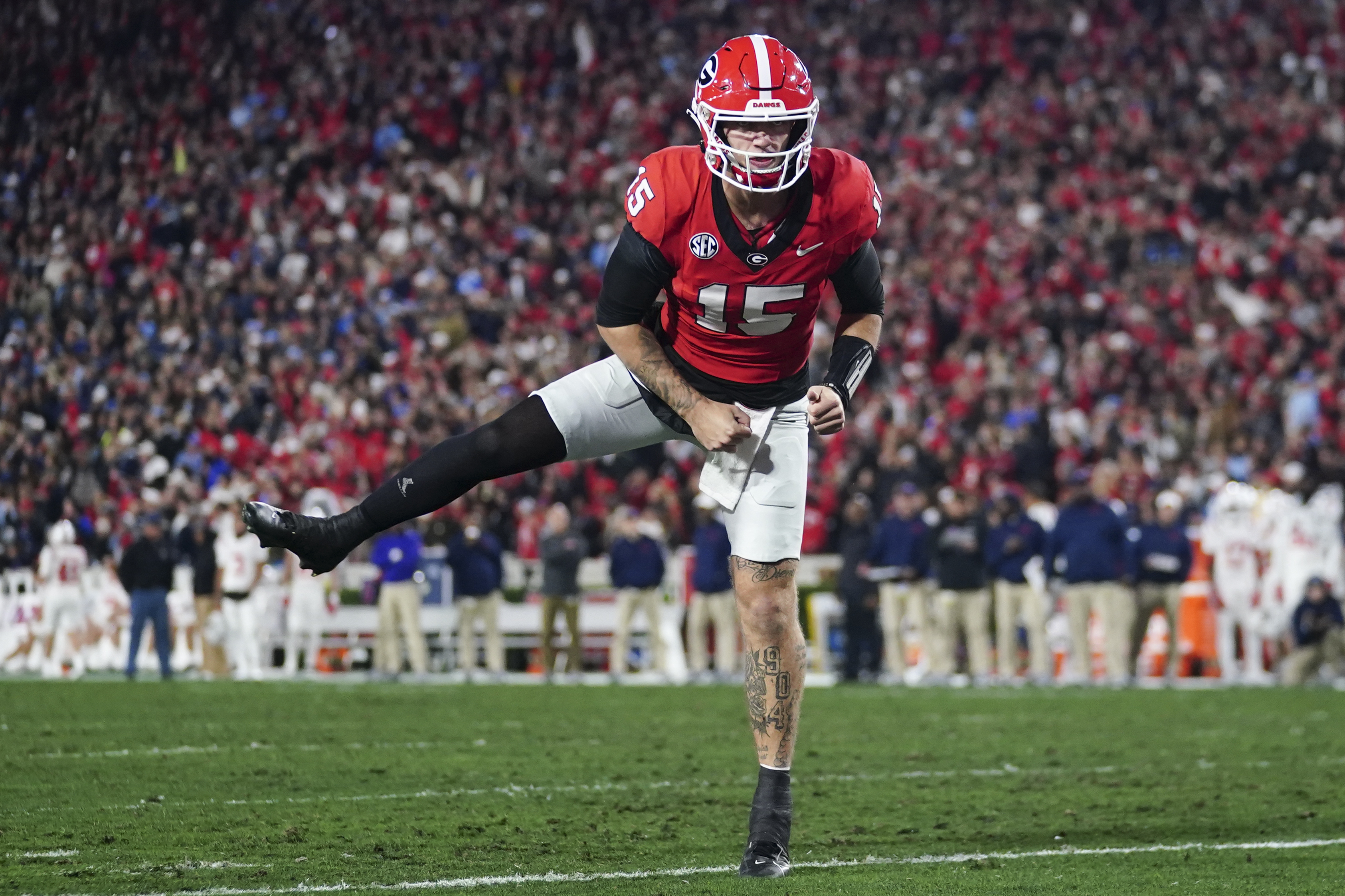 FILE - Georgia quarterback Carson Beck (15) reacts after a touchdown against Mississippi during the first half of an NCAA college football game, Saturday, Nov. 11, 2023, in Athens, Ga.