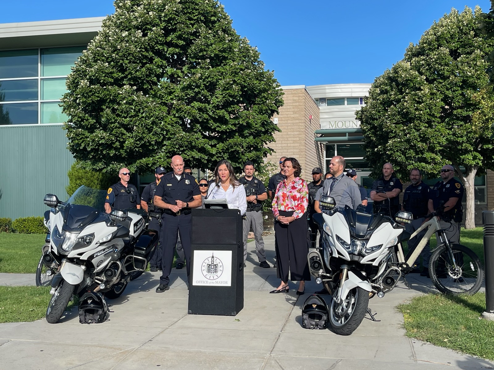 Salt Lake City Police Chief Mike Brown, Mayor Erin Mendenhall, Salt Lake City School District Superintendent Elizabeth Grant and Mountain View Elementary School Principal Jason Finch speak Monday at Mountain View Elementary School. 