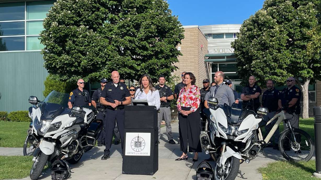 Salt Lake City Police Chief Mike Brown, Mayor Erin Mendenhall, Salt Lake City School District Superintendent Elizabeth Grant and Mountain View Elementary School Principal Jason Finch speak Monday at Mountain View Elementary School.