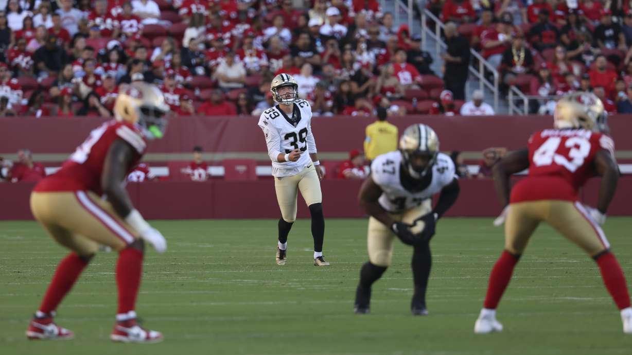 New Orleans Saints place kicker Charlie Smyth (39) watches his kickoff during the first half of a preseason NFL football game against the San Francisco 49ers in Santa Clara, Calif., Sunday, Aug. 18, 2024.