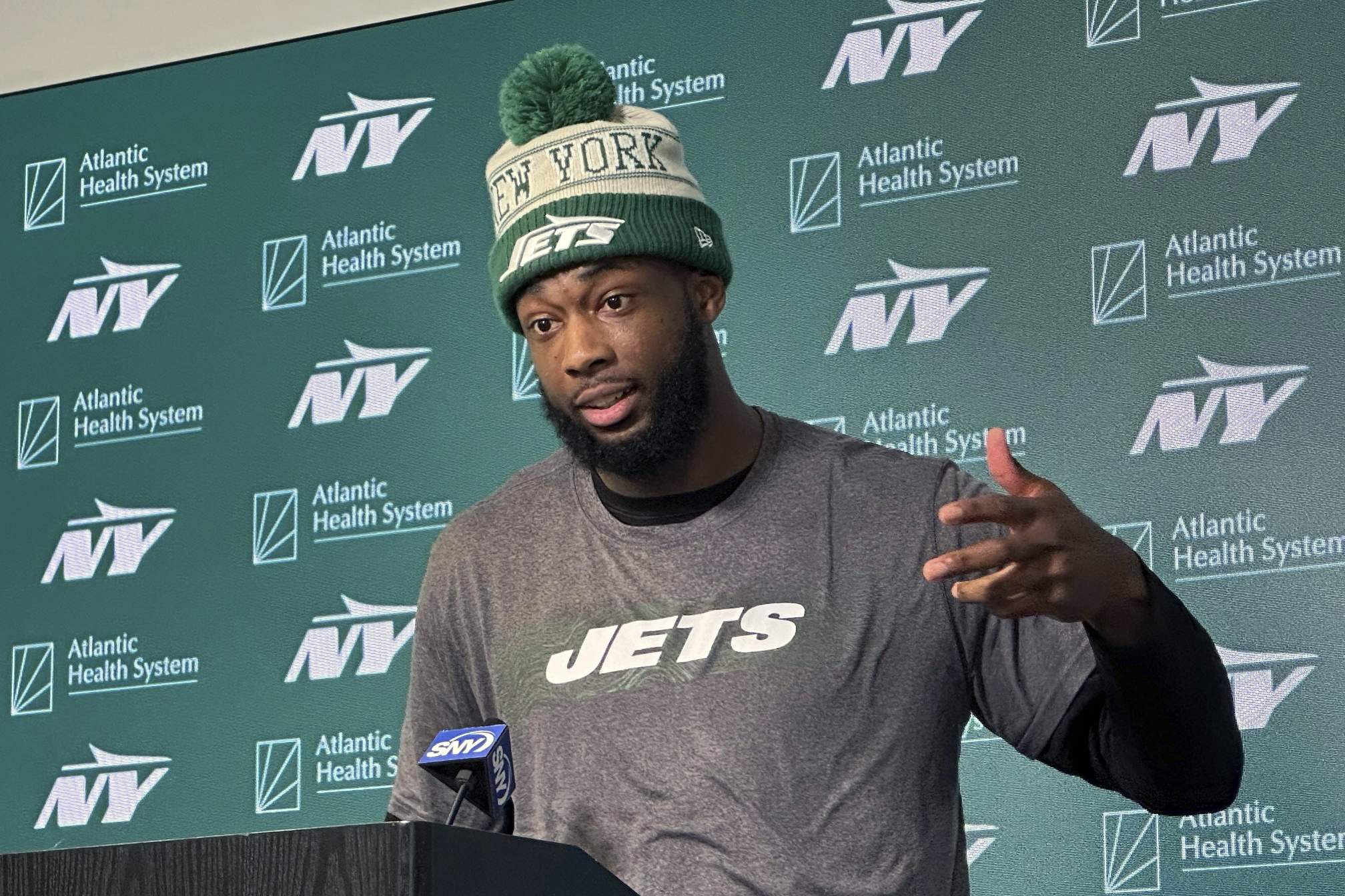 FILE - New York Jets wide receiver Mike Williams speaks to reporters at the team's NFL football training facility in Florham Park, N.J., June 12, 2024. 