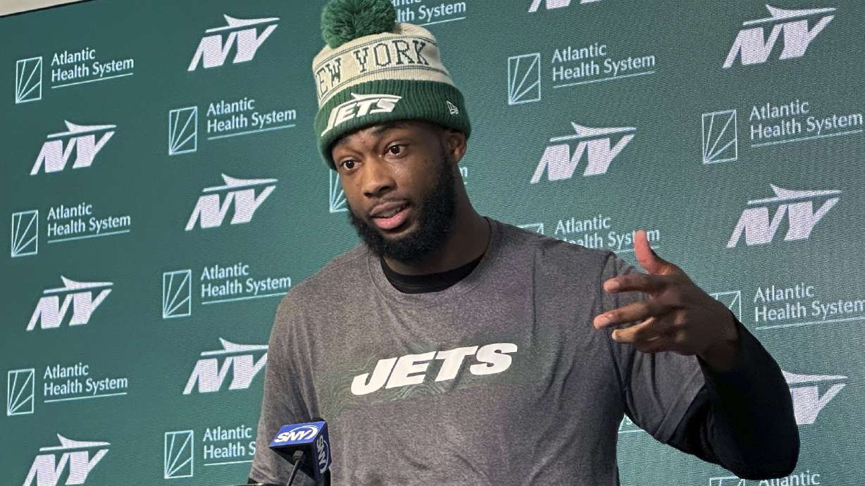 FILE - New York Jets wide receiver Mike Williams speaks to reporters at the team's NFL football training facility in Florham Park, N.J., June 12, 2024.
