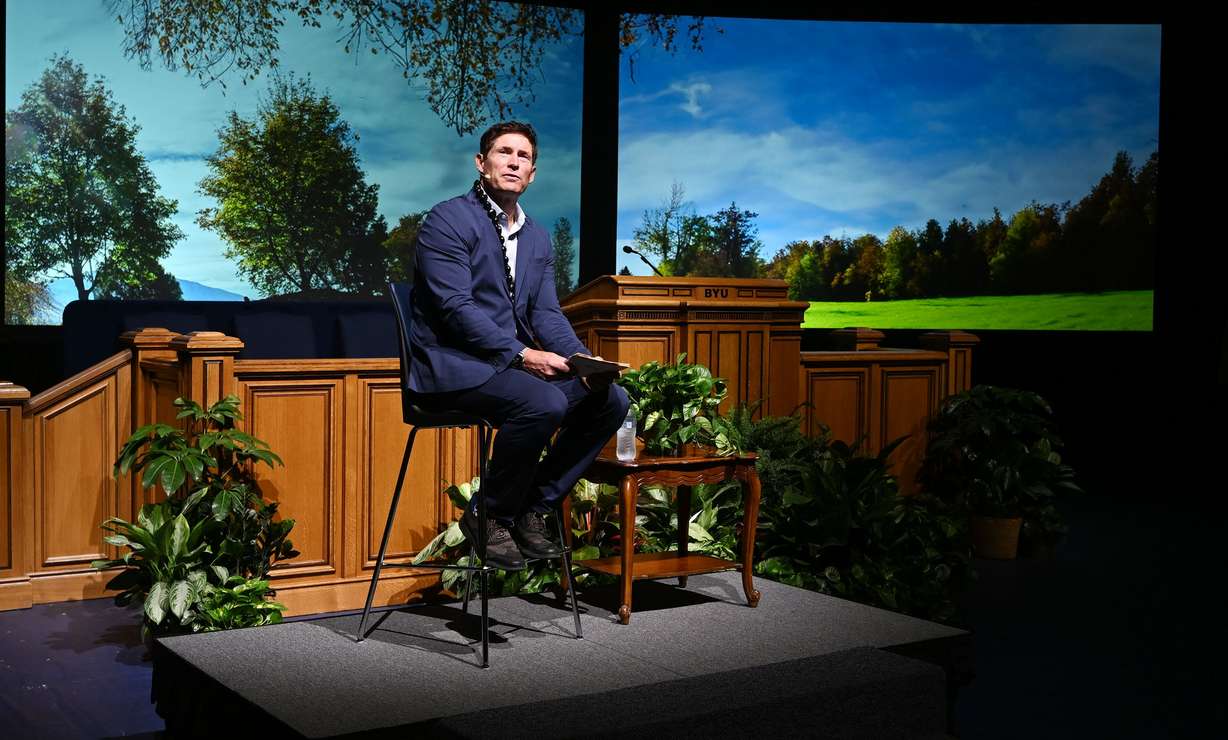 Steve Young speaks during BYU Education Week at the Marriott Center in Provo on Monday.