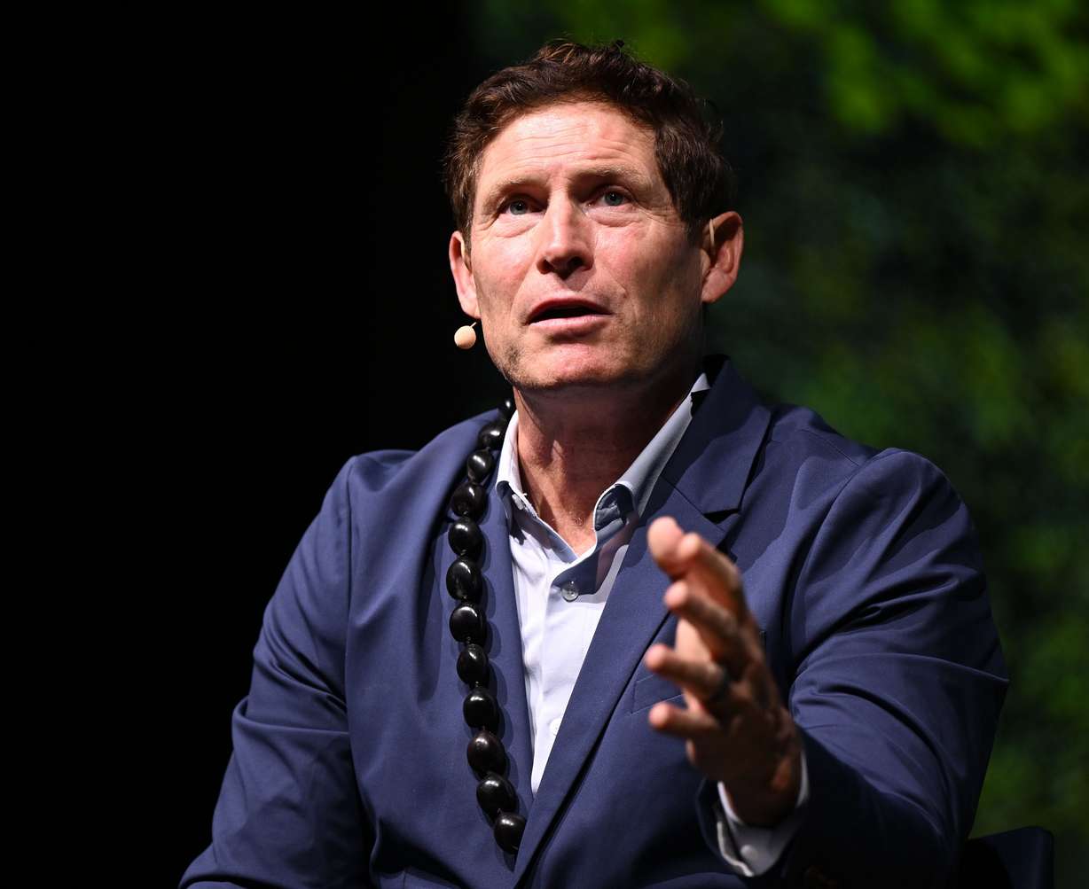 Steve Young speaks during BYU Education Week at the Marriott Center in Provo on Monday.