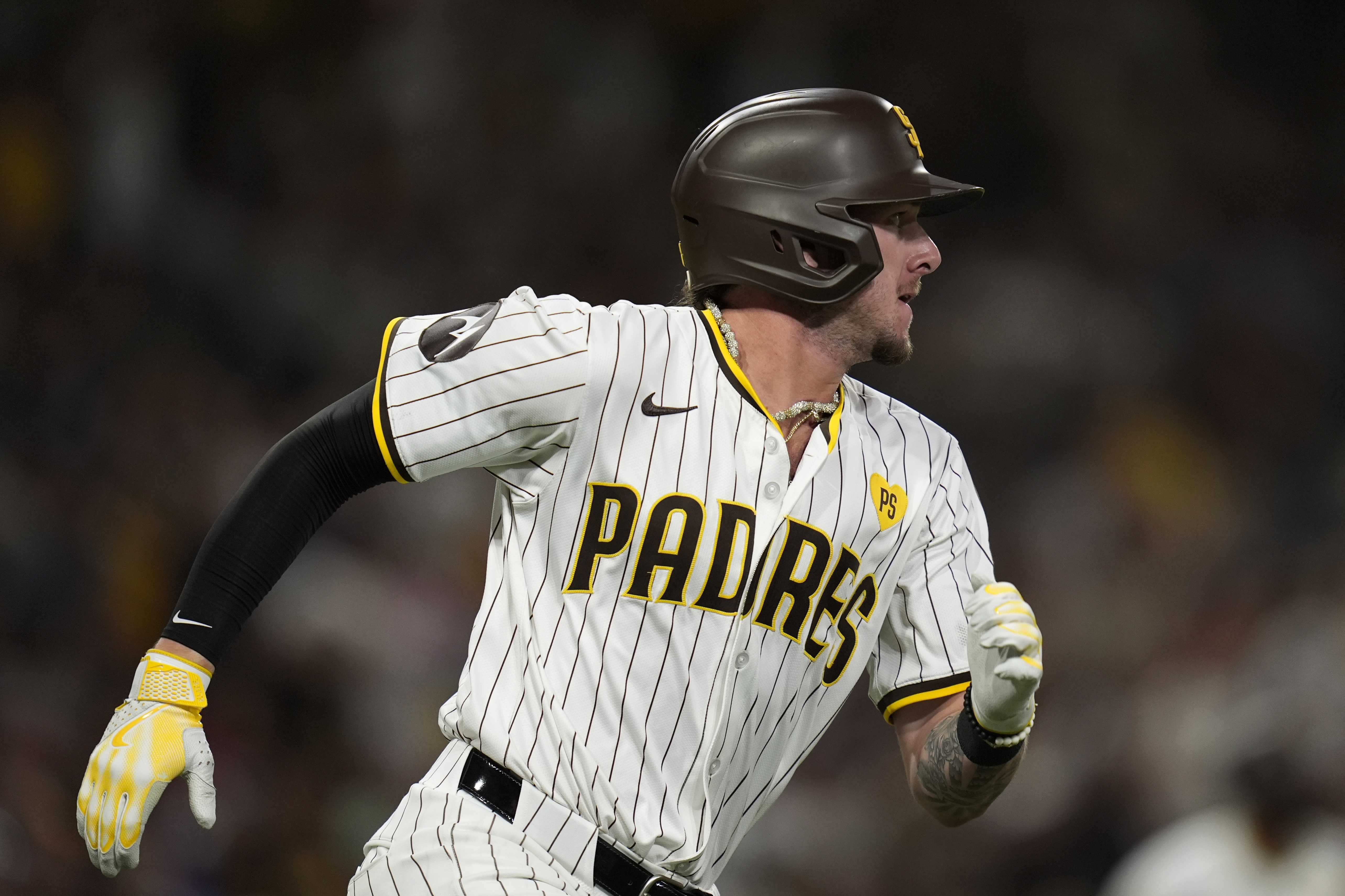 San Diego Padres' Jackson Merrill watches his three-RBI double during the third inning of a baseball game against the Minnesota Twins, Monday, Aug. 19, 2024, in San Diego.