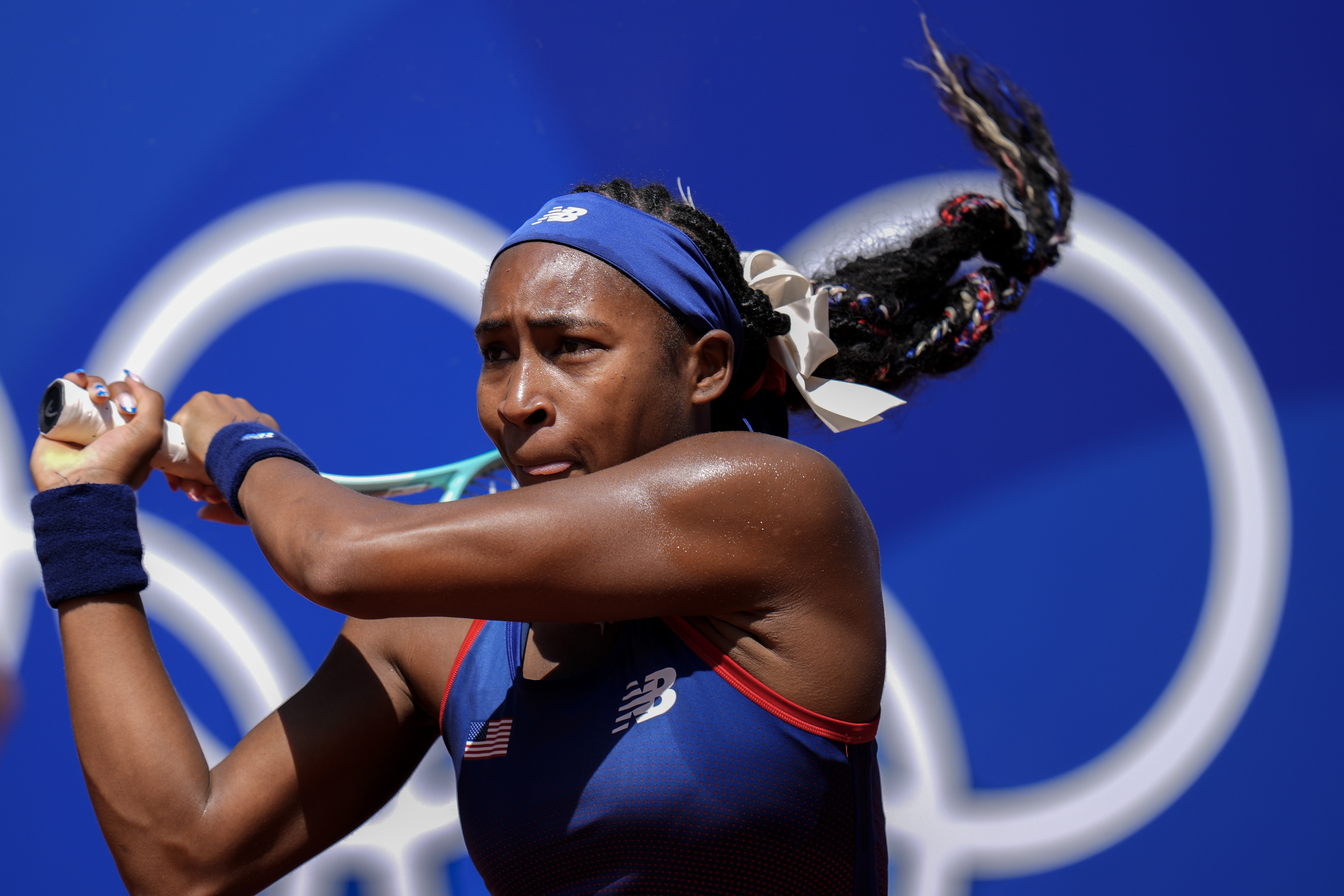 Coco Gauff of the United States returns the ball against Maria Lourdes Carle of Argentina during the women's singles tennis competition at the Roland Garros Stadium at the 2024 Summer Olympics on Monday, July 29, 2024, in Paris, France.