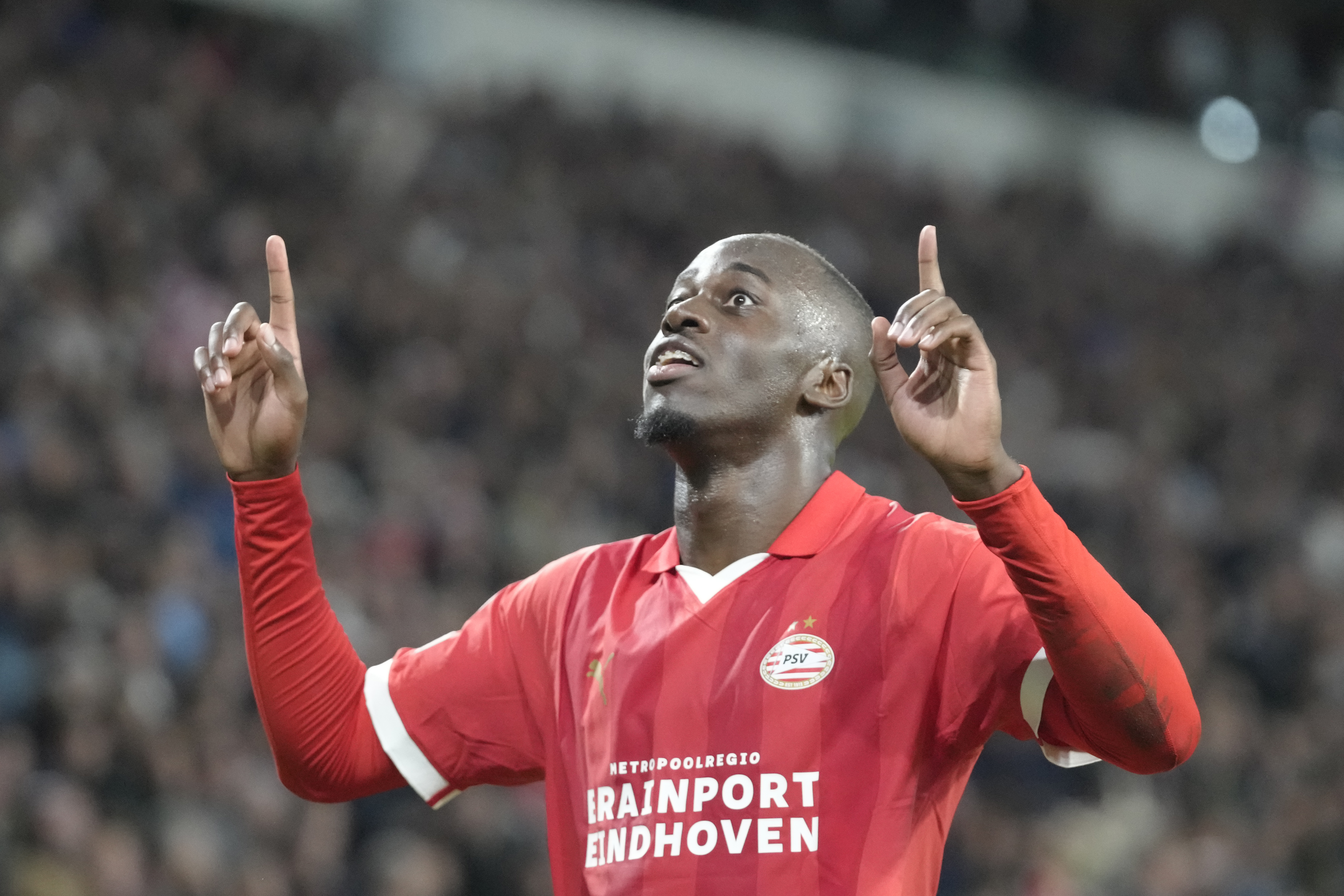 FILE - PSV's Jordan Teze celebrates after scoring his side's second goal during the Group B Champions League soccer match between PSV and Sevilla at Philips stadium in Eindhoven, Netherlands, on Oct. 3, 2023. 