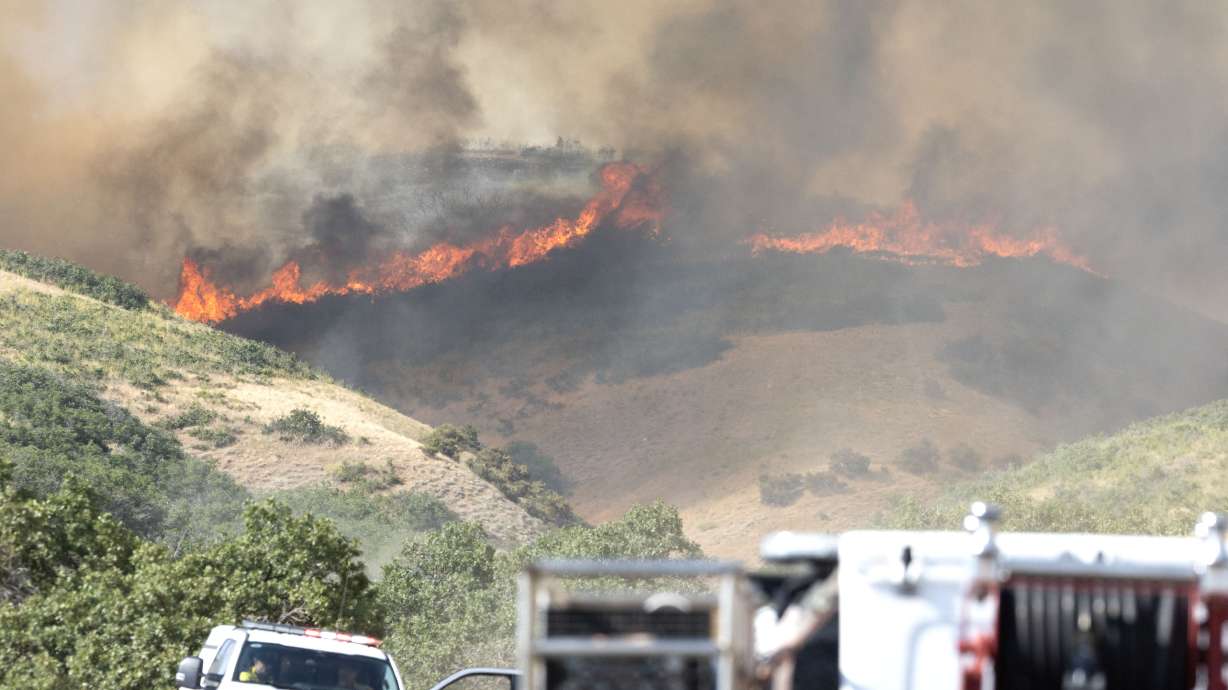 Firefighters prepare to battle the flames around Ensign Peak in Salt Lake City on July 20, 2024. Fire experts say Utah's conditions will likely get worse in the coming weeks before potentially improving by the end of summer.