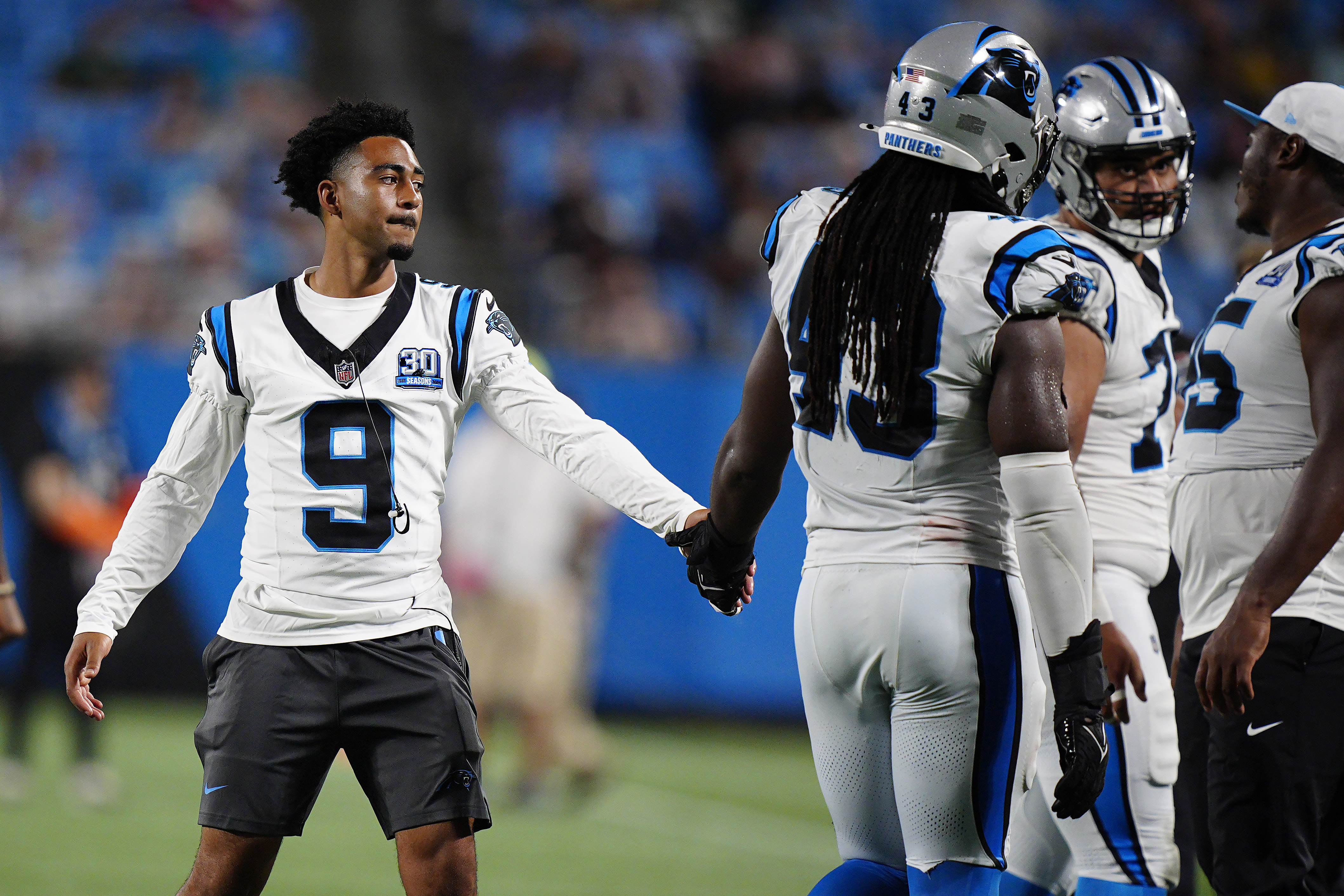 Carolina Panthers quarterback Bryce Young (9) greets teammates during the second half of a preseason NFL football game against the New York Jets, Saturday, Aug. 17, 2024, in Charlotte, N.C. 