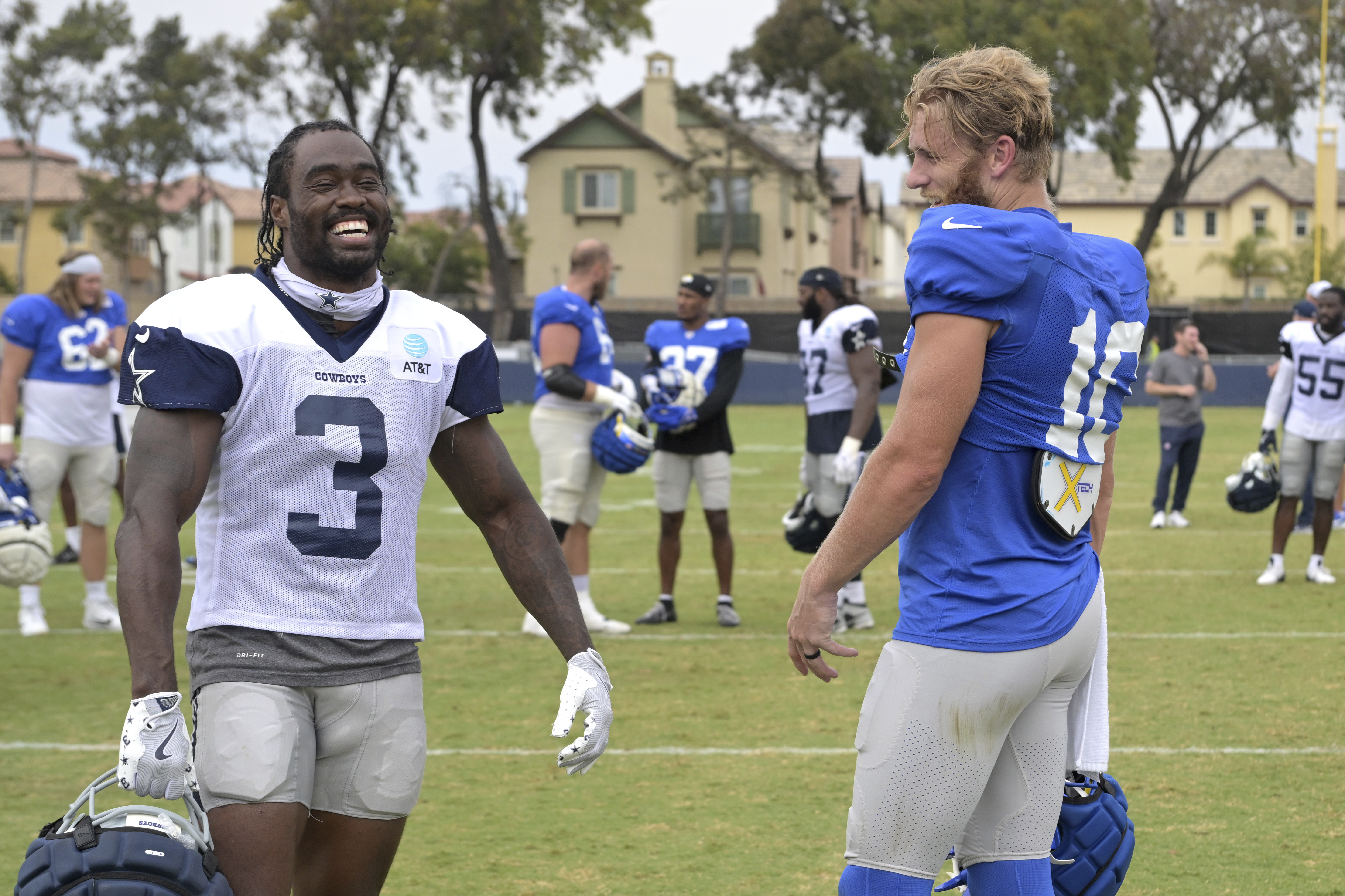 Dallas Cowboys wide receiver Brandin Cooks, left, and Los Angeles Rams wide receiver Cooper Kupp talk on the field following joint practice at NFL football training camp Thursday, Aug. 8, 2024, in Oxnard, Calif. 