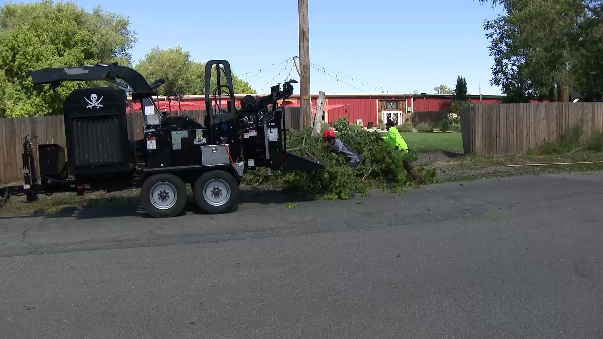 City workers clean up the mess Tuesday after a storm hit Monday near The Hideaway on Angel events center in Layton.