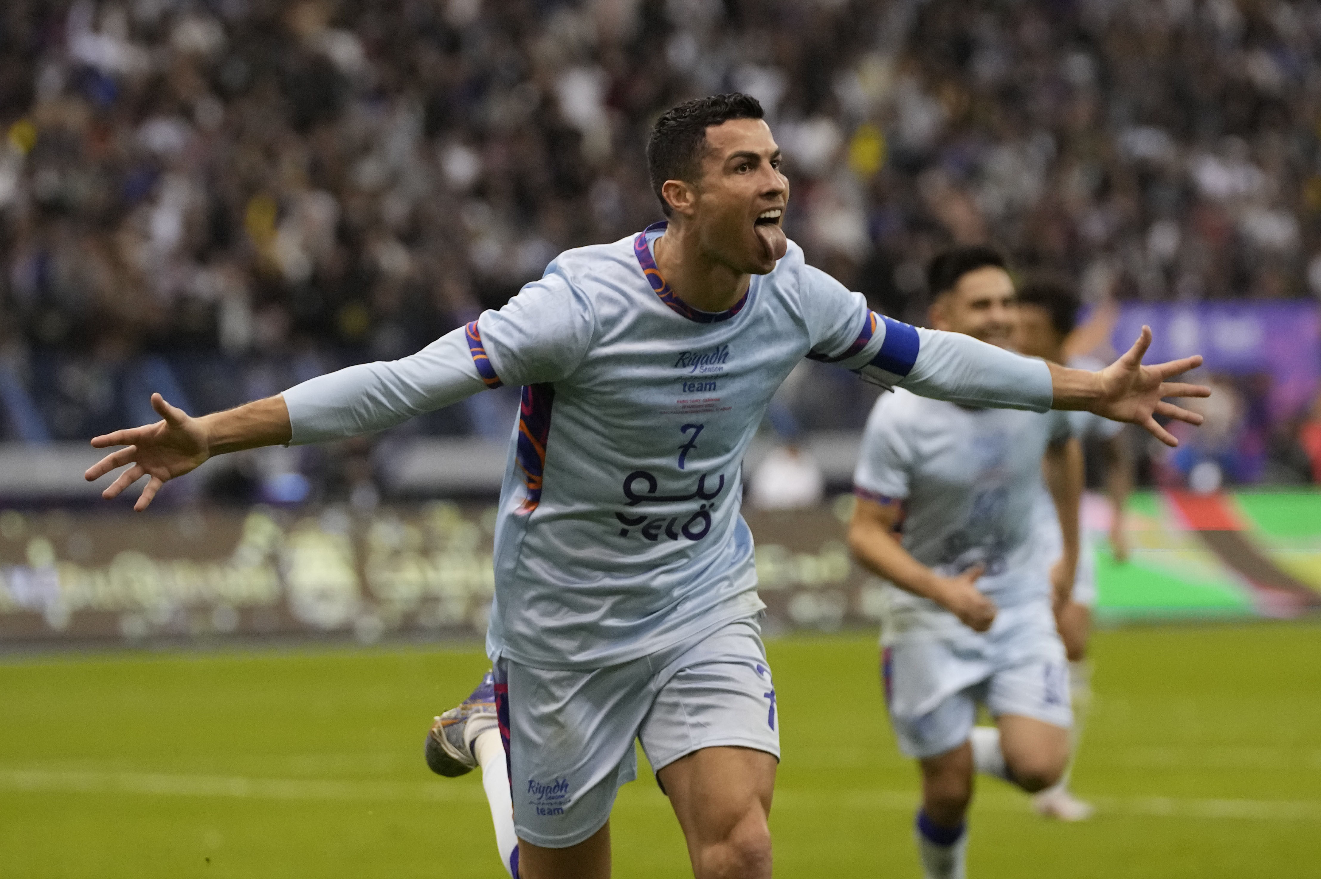 FILE - Cristiano Ronaldo celebrates after scoring his side's second goal playing for a combined XI of Saudi Arabian teams Al Nassr and PSG during a friendly soccer match at the King Saud University Stadium in Riyadh, Saudi Arabia, Jan. 19, 2023. 