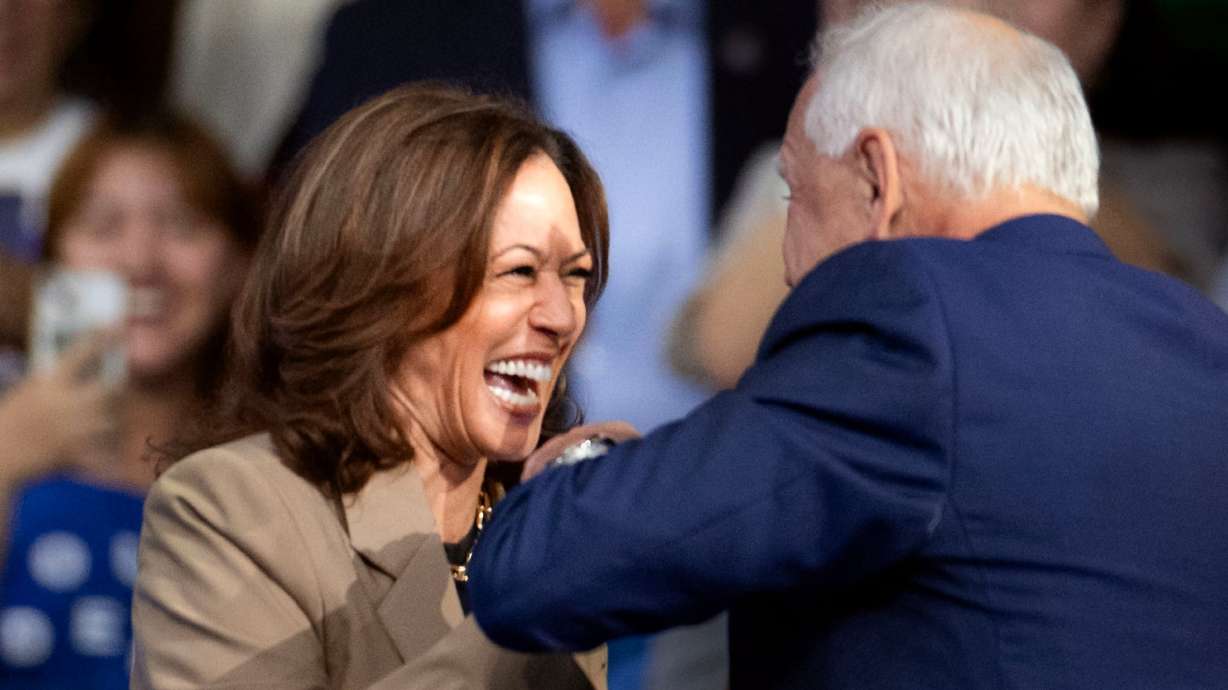 Vice President Kamala Harris greets her running mate, Minnesota Gov. Tim Walz in Glendale, Ariz., on Aug. 9. Harris is not taking sit-down interviews with the media, the Washington Post editorial board noted.