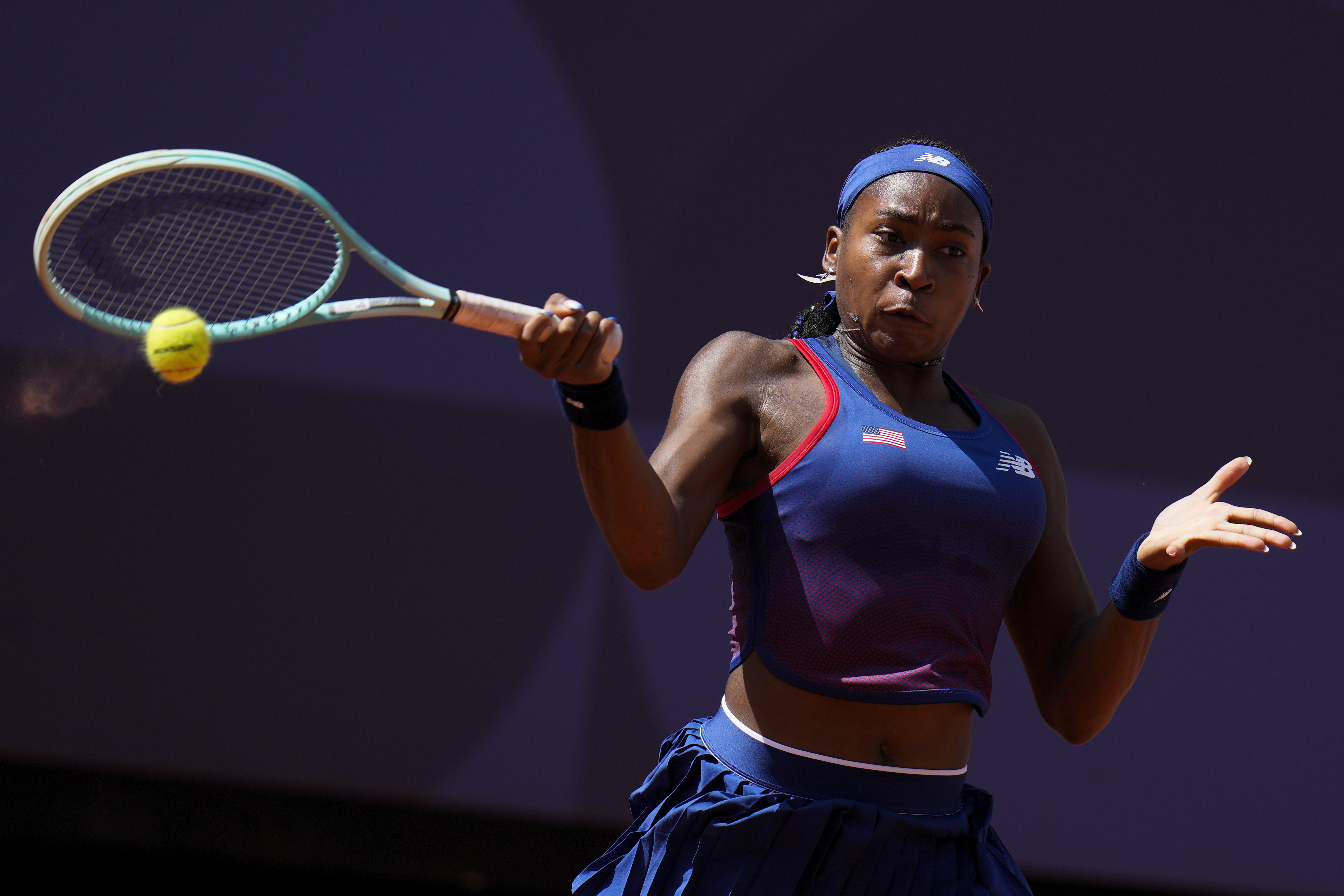 Coco Gauff of United States returns a shot to Donna Vekic of Croatiathe during their women's singles third round match at the Roland Garros stadium, at the 2024 Summer Olympics, Tuesday, July 30, 2024, in Paris, France. 