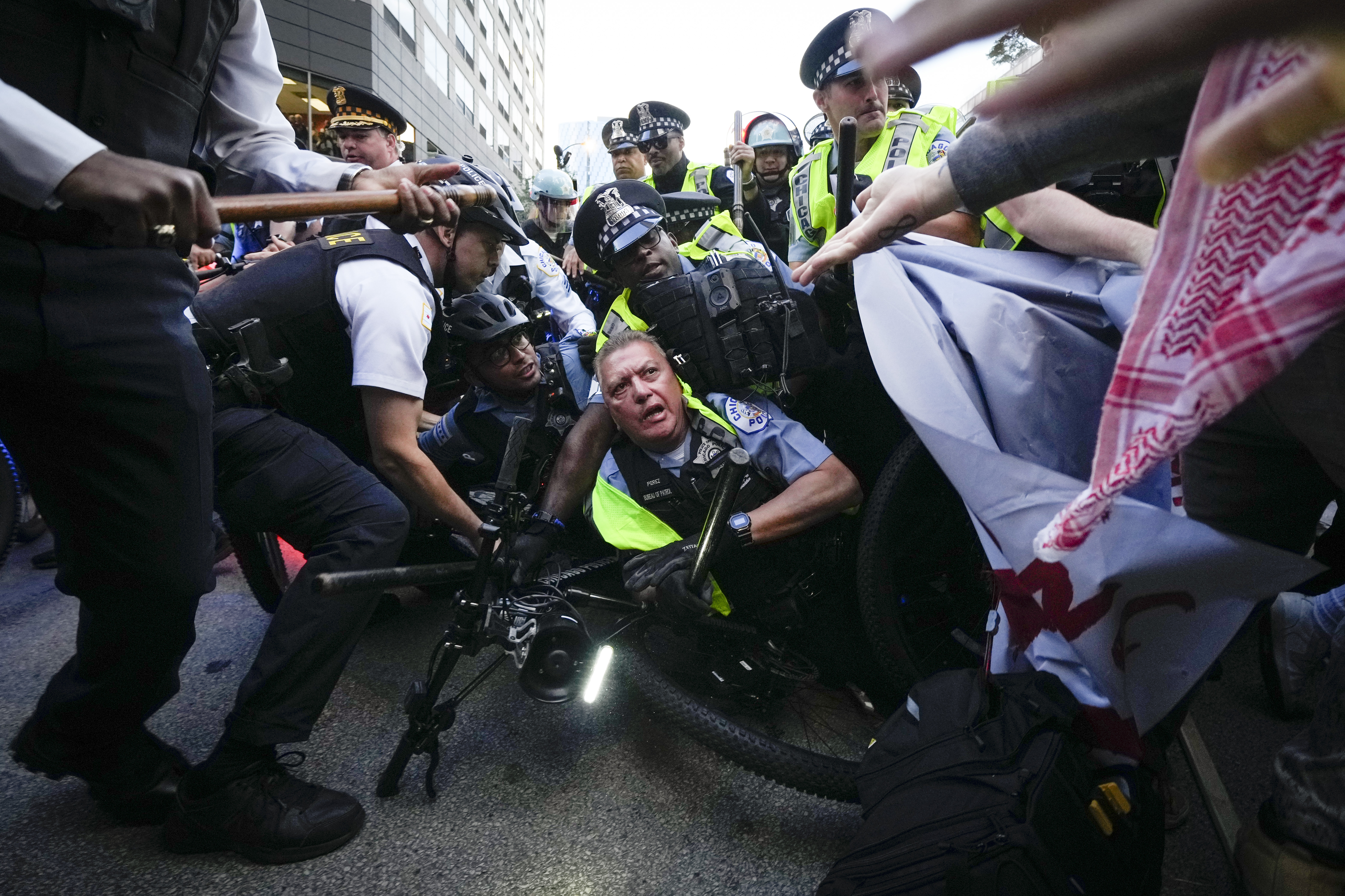 Demonstrators clash with police near the Israeli Consulate during the Democratic National Convention Tuesday in Chicago.