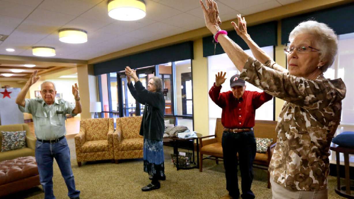 Denver Carder, Barbara Wardle, David Dowdle and Idora Meier participate in Tai Chi at an assisted living center in South Jordan on Aug. 9, 2016. Alzheimer's and dementia cases are increasing in Utah, a new report finds.