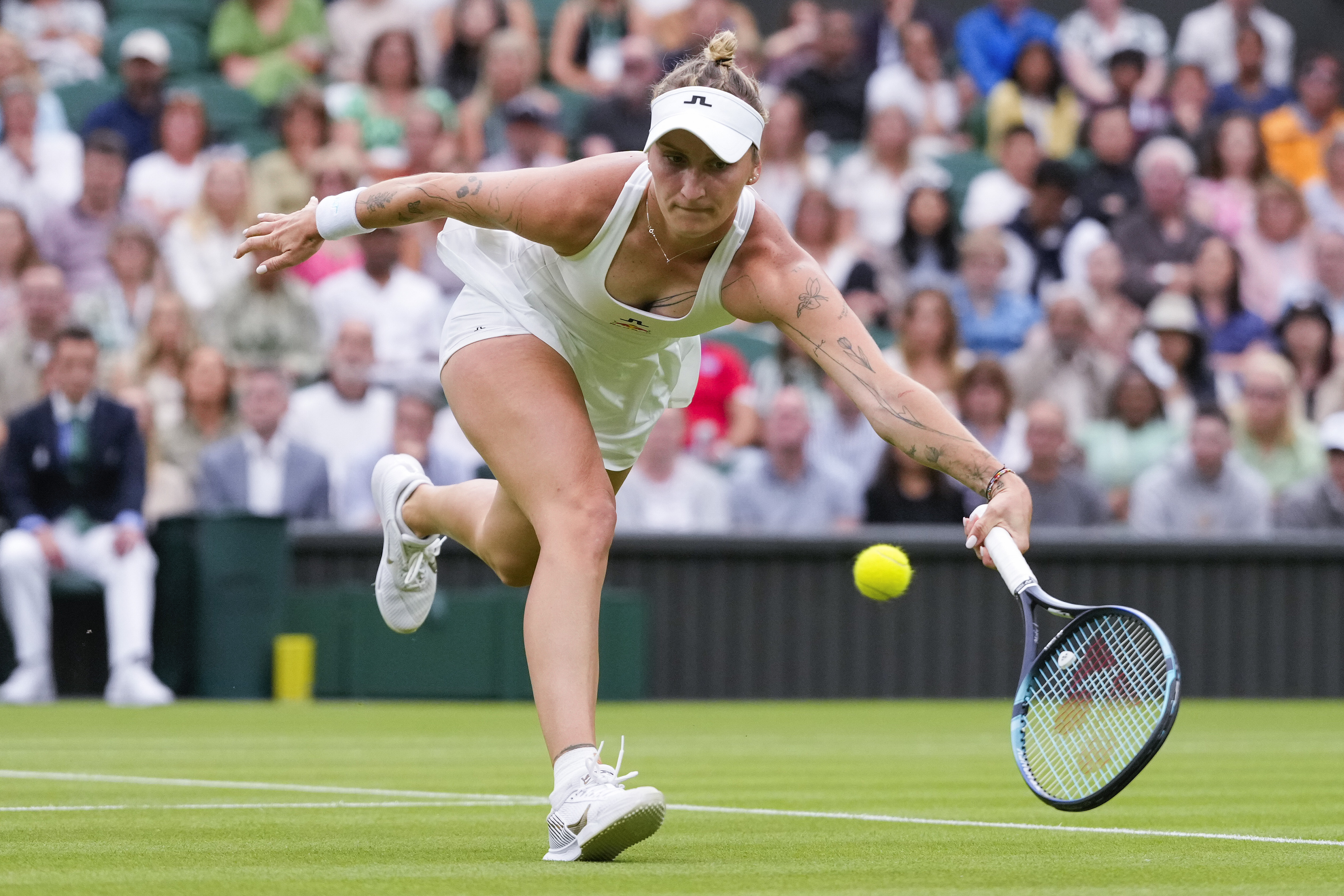 FILE - Marketa Vondrousova of the Czech Republic plays a forehand return to Jessica Bouzas Maneiro of Spain during their first round match at the Wimbledon tennis championships in London, July 2, 2024. 