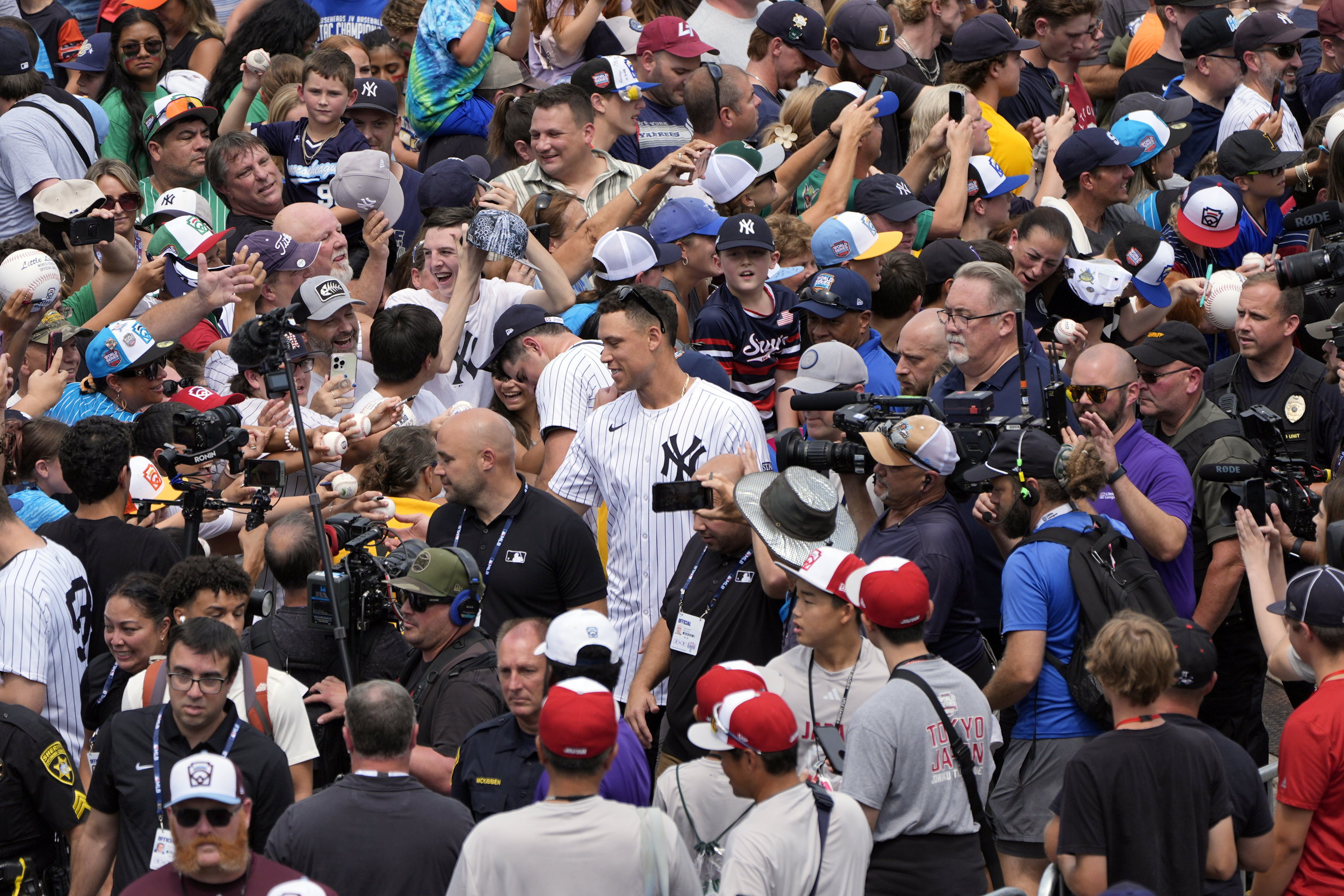 New York Yankees' Aaron Judge, center, is seen as the New York Yankees arrive at the Little League World Series Complex to watch the Little League World Series tournament in South Williamsport, Pa., Sunday, Aug. 18, 2024. 