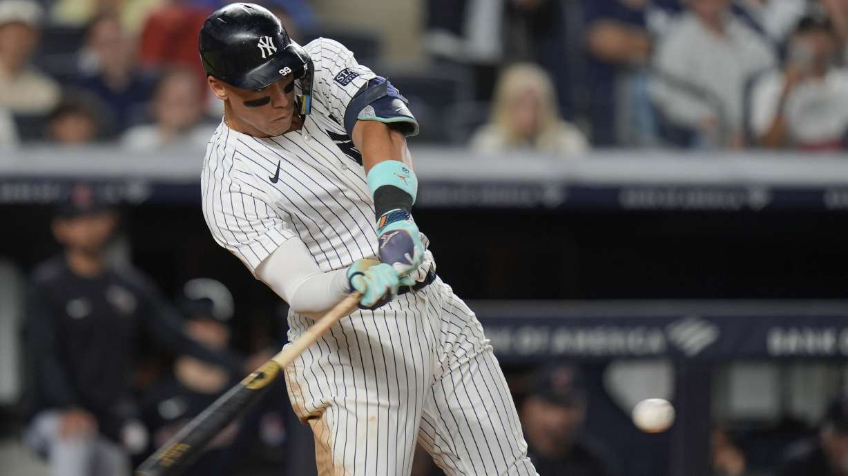 New York Yankees' Aaron Judge hits a solo home run during the seventh inning of a baseball game against the Cleveland Guardians, Wednesday, Aug. 21, 2024, in New York.