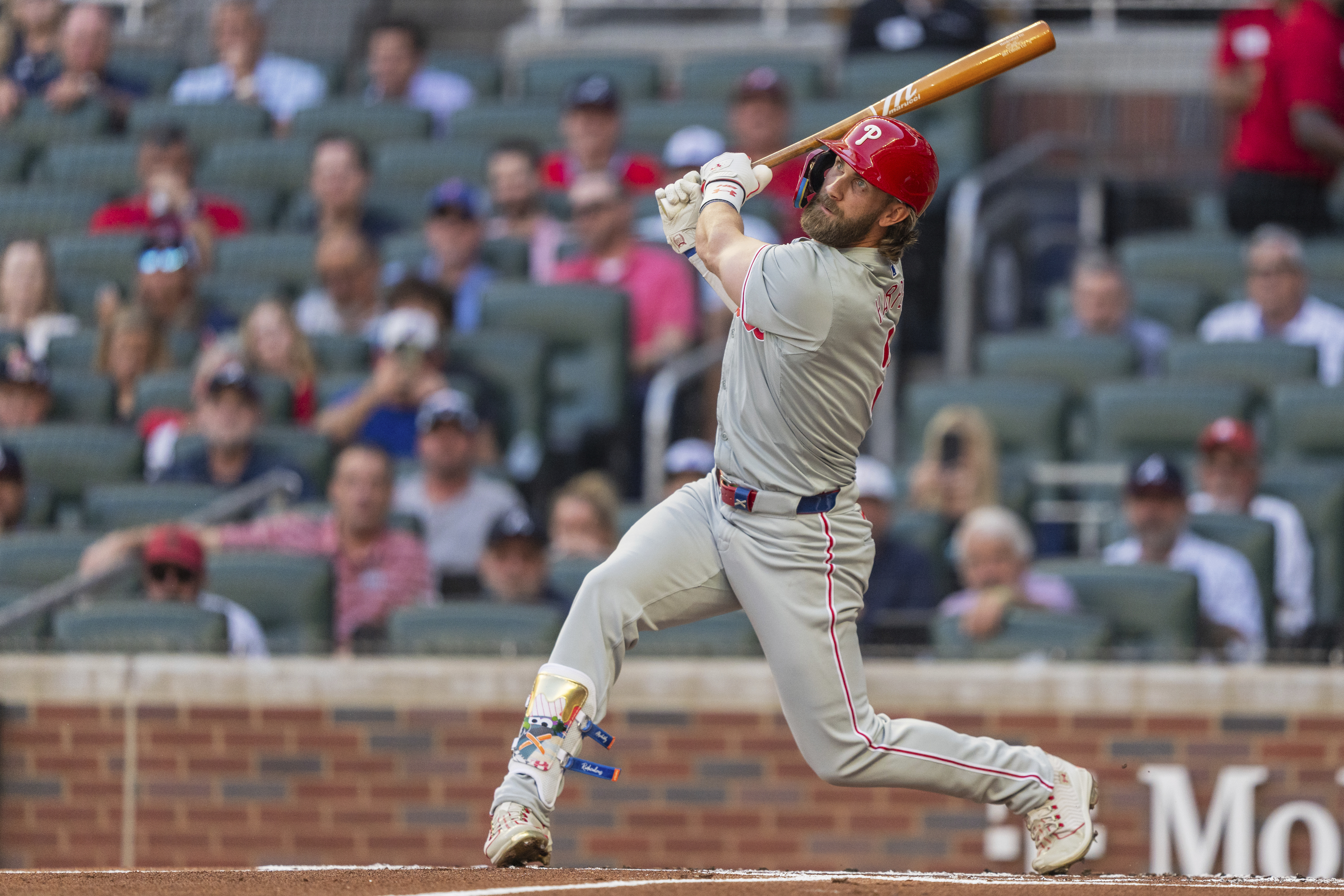 Philadelphia Phillies' Bryce Harper hits a foul ball in the first inning of a baseball game against the Atlanta Braves, Wednesday, Aug. 21, 2024, in Atlanta.