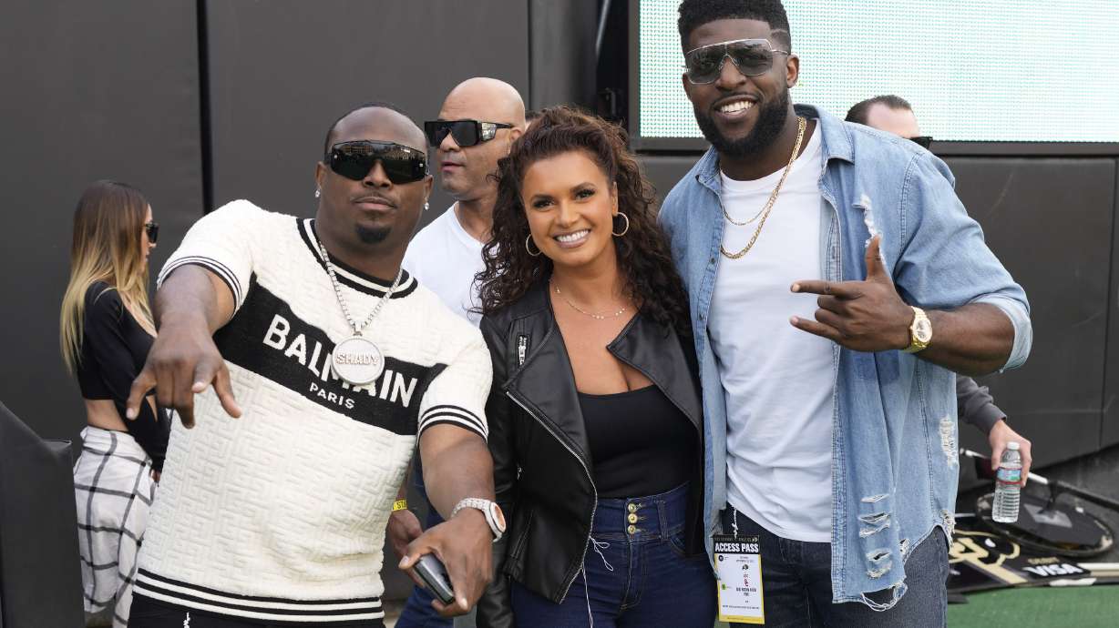 FILE - From left, television commentators LeSean McCoy, Joy Taylor and Emmanuel Acho before an NCAA college football game Saturday, Sept. 30, 2023, in Boulder, Colo.