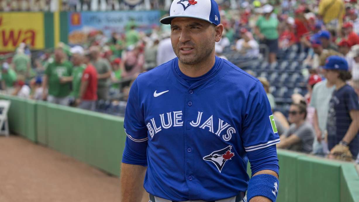 FILE - Toronto Blue Jays' Joey Votto walks to the dugout before a spring training baseball game against the Philadelphia Phillies, March 17, 2024, in Clearwater, Fla.