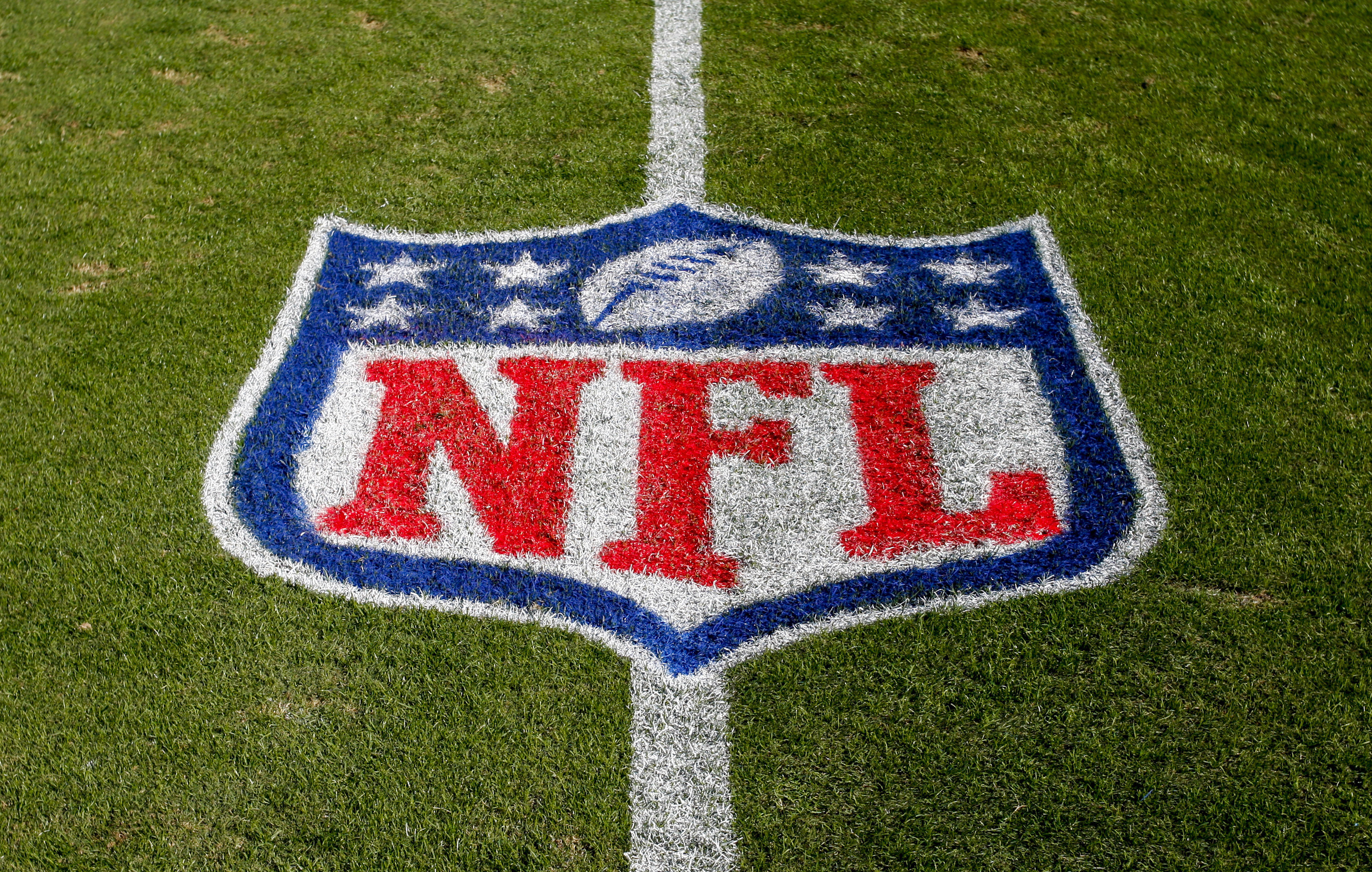 FILE - The NFL logo is displayed on the field at the Bank of American Stadium, Nov. 4, 2018, in Charlotte, N.C. The judge who presided in the class-action lawsuit filed by “Sunday Ticket” subscribers against the NFL said the jury did not follow his instructions in determining damages. 