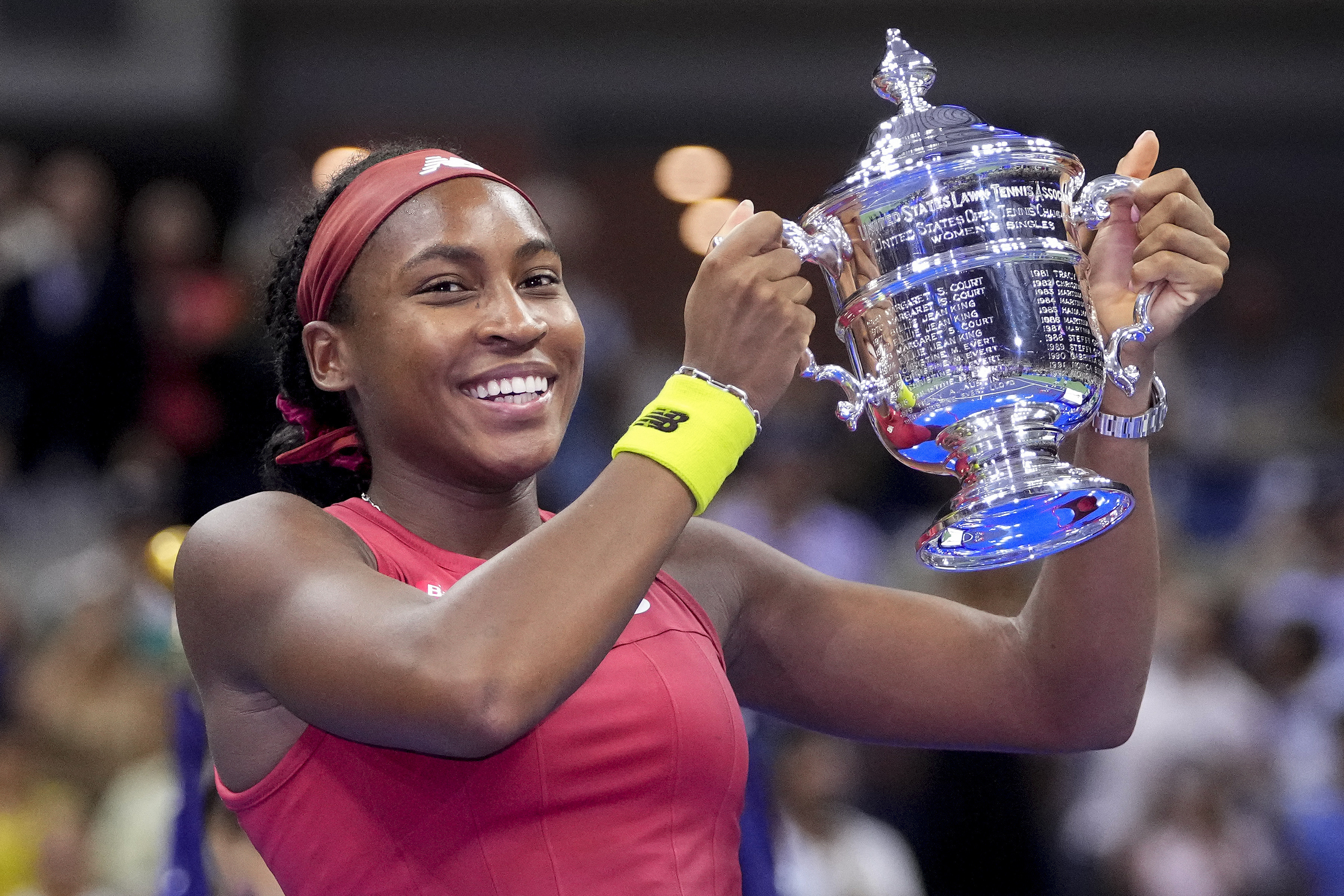 FILE - Coco Gauff holds up the championship trophy after defeating Aryna Sabalenka, of Belarus, in the women's singles final of the U.S. Open tennis championships, Saturday, Sept. 9, 2023, in New York.