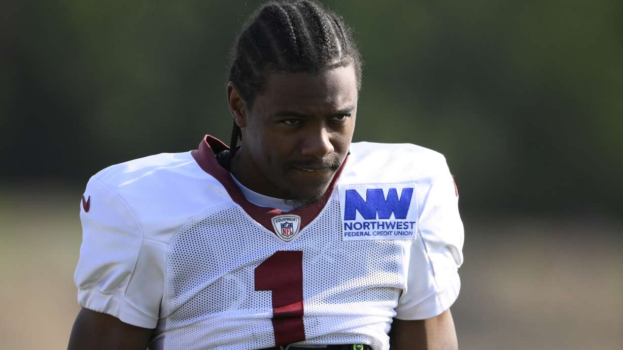 FILE - Washington Commanders wide receiver Jahan Dotson (1) works out during NFL football training camp, Monday, July 29, 2024, in Ashburn, Va.