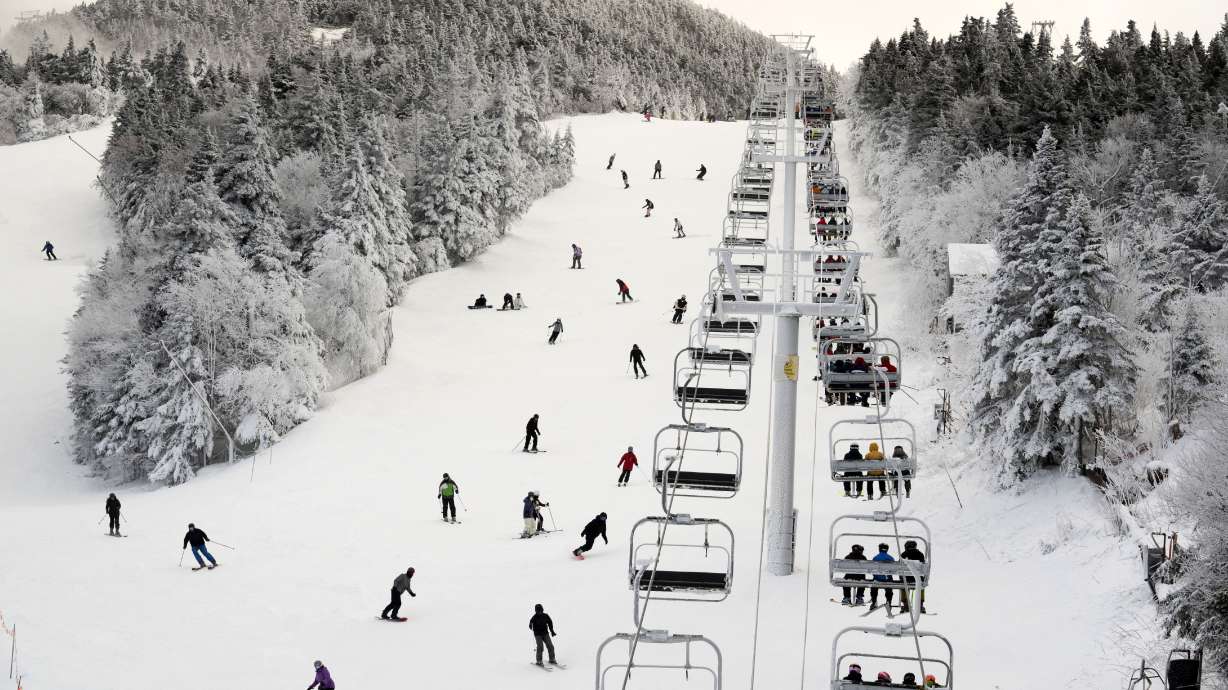 FILE - Thanksgiving holiday skiers descend near the North Ridge Quad chairlift, Nov. 24, 2023, at Killington Ski Resort in Killington, Vt.