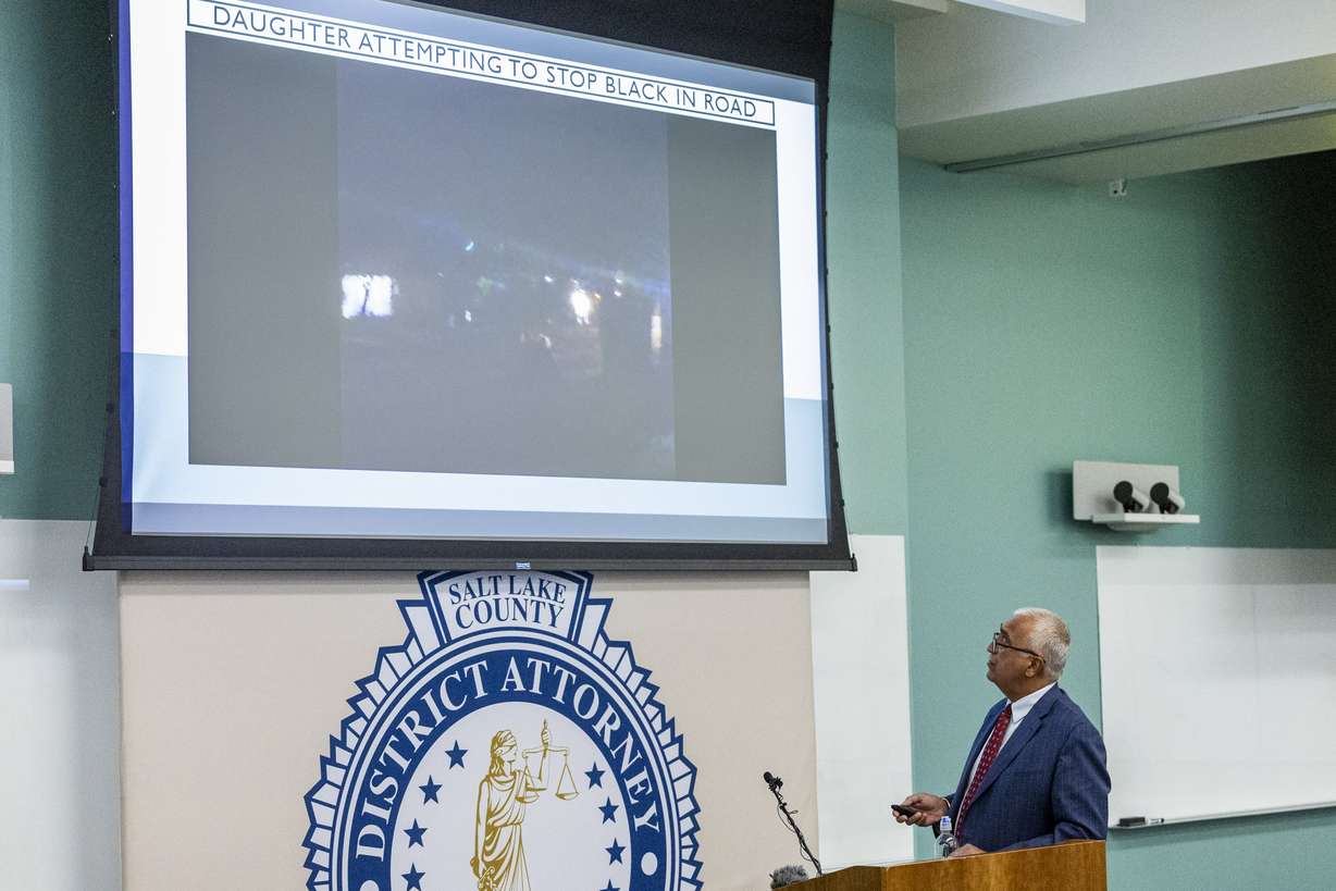 Salt Lake County District Attorney Sim Gill shows video evidence as he speaks during a review of a past officer-involved critical incident held at the Salt Lake County District Attorney’s Office building in Salt Lake City on Thursday.